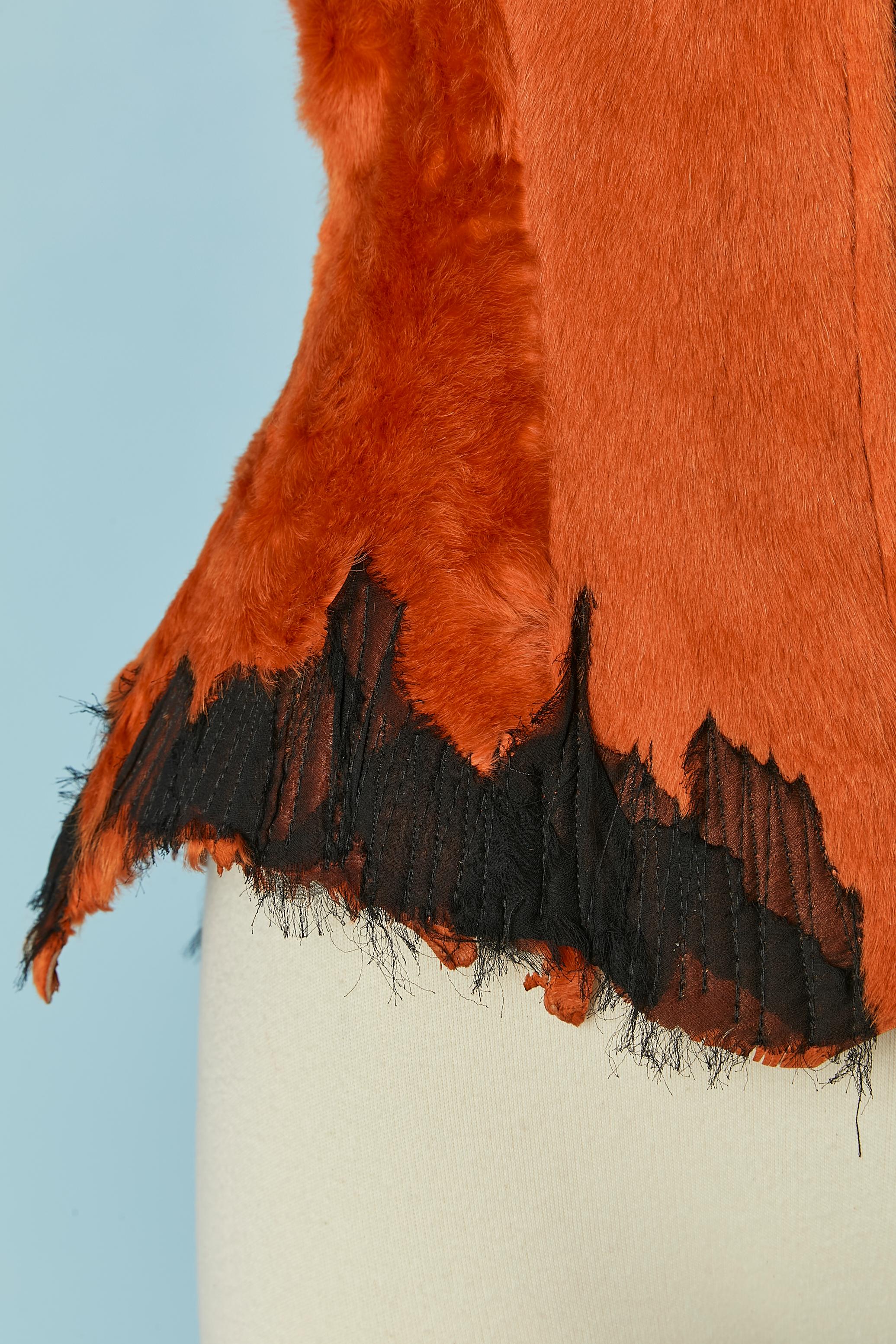 Orange furs vest with zip closure in the middle font. Top-stitched on the edge on black chiffon . No fabric composition tag but the furs is probably cow and lining in rayon ( printed)
Oscar Carvallo was born in Caracas, Venezuela. As a child, he was