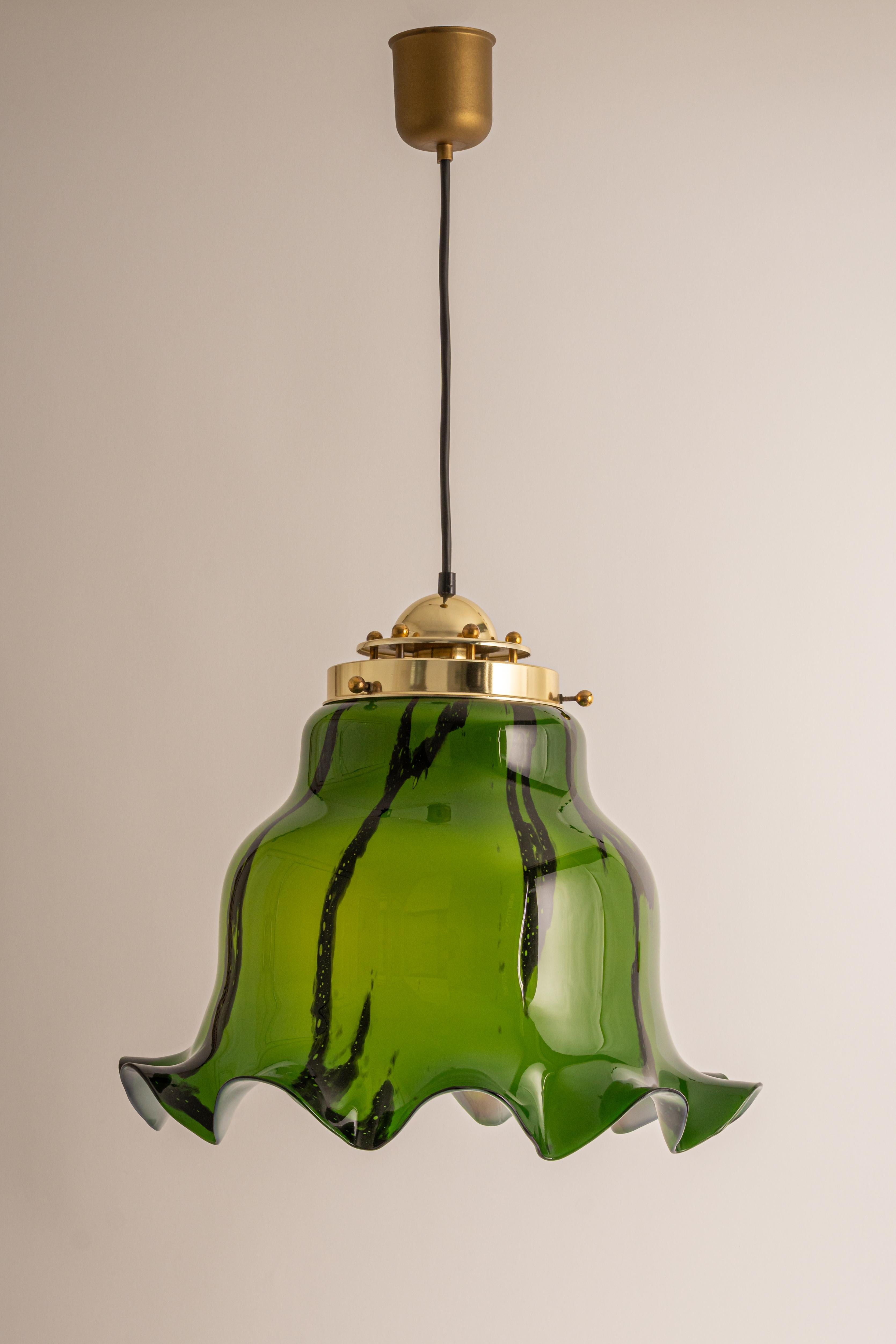 Grenn glass pendant light by Peill & Putzler, manufactured in Germany, circa the 1970s.

High quality and in very good condition. Cleaned, well-wired and ready to use. 
The fixture requires 1x E27 Standard bulbs with 100W max
Light bulbs are not