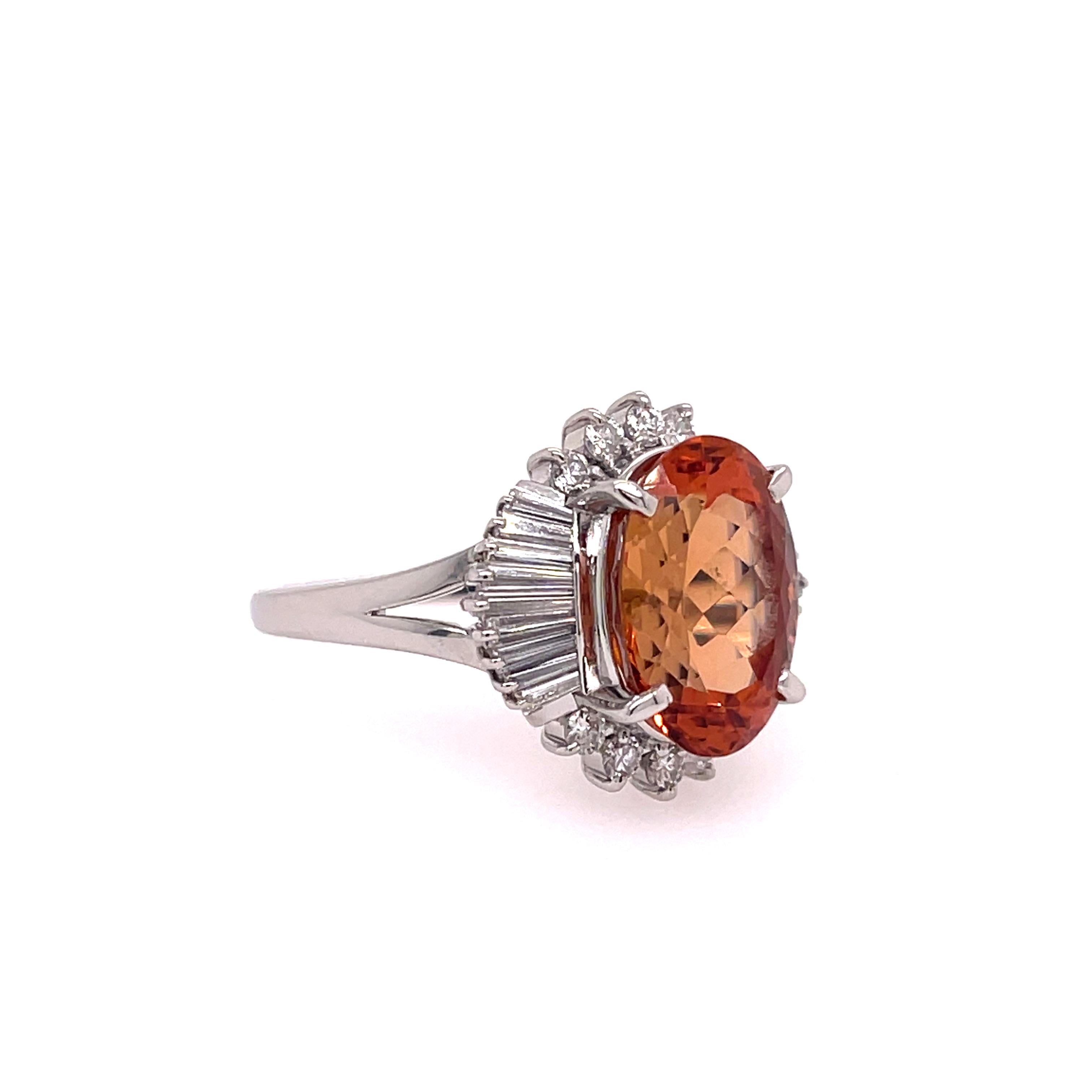 Orange Imperial Topaz (GIA Certified) & Diamond Platinum Ring. The ring features a 6.02ct oval orange imperial topaz and 0.72ctw of diamonds. Ring size 7.50, can be sized.

9.34 grams