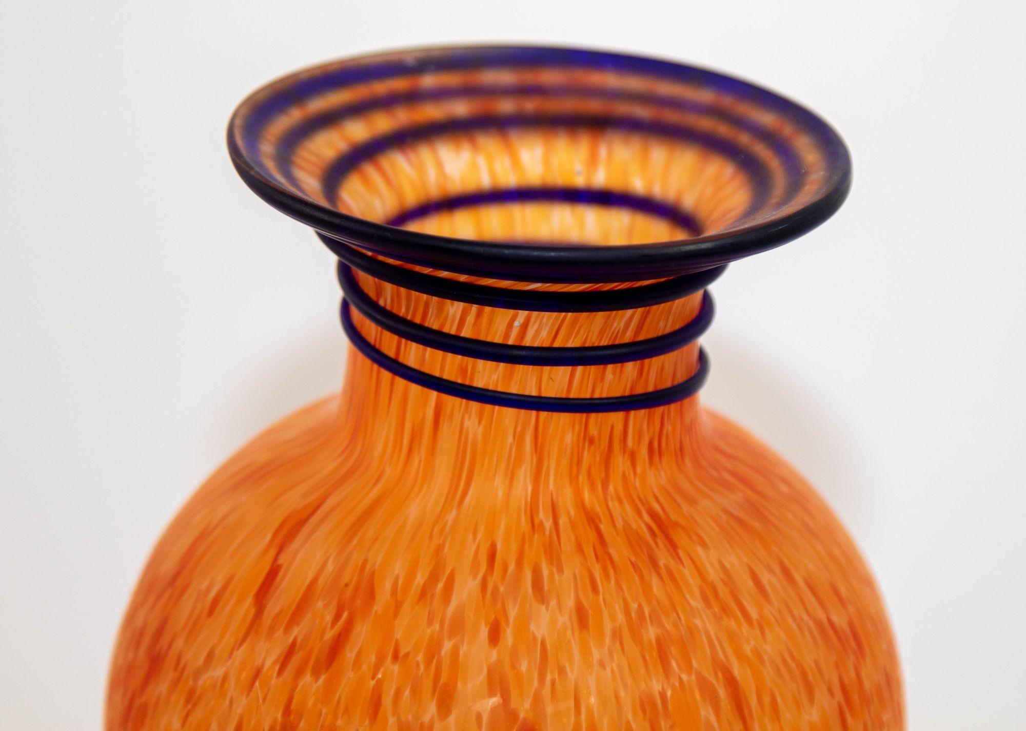 Murano Italian Art multi-color confetti glass vase, urn shaped vase, Italy.
1960s Vintage beautiful urn shape delicate hand blown Italian art glass vase with speckled orange with a blue spiral stripe on top of the neck.
Lovely to be used as