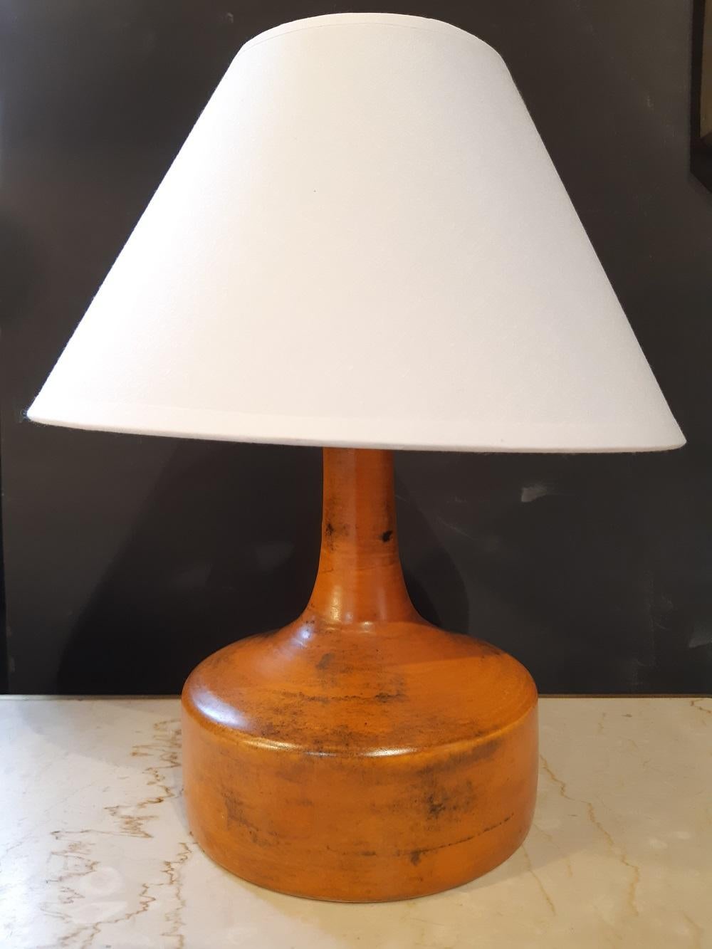 Orange Jacques Blin ceramic lamp France midcentury, 1950
 
Electricity ok and new lampshade provided. 
Signed under the base. 
Measures: Socket height 16.5cm. Height with shade 30cm. Diameter 16cm

Excellent condition.
  