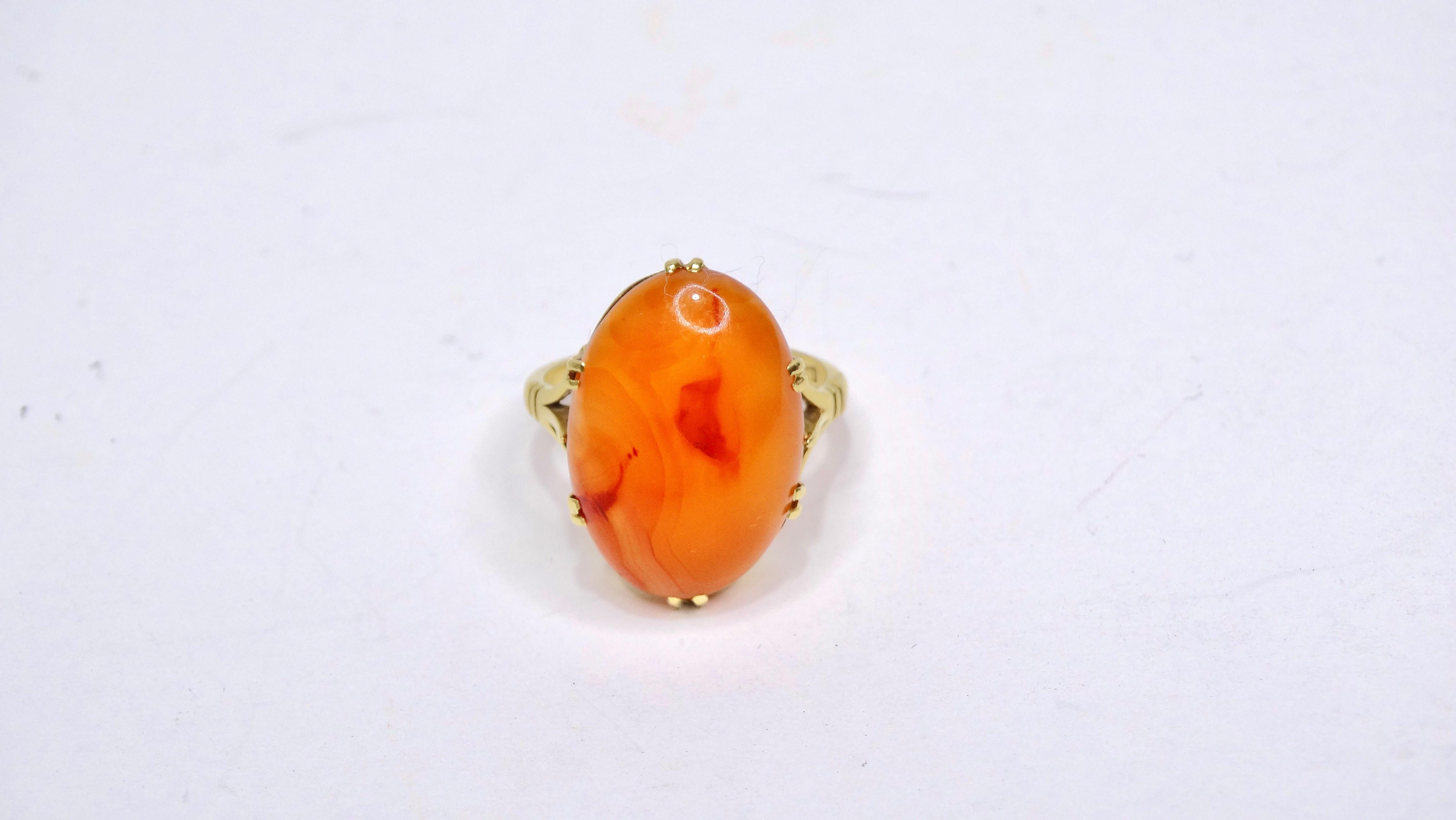 This impeccably designed ring can be yours today! Don't miss your chance to get your hands on this huge Orange Jade stone in an oval cut. Orange Jade brings joy and teaches the interconnectedness of all beings. This will be your new favorite fashion