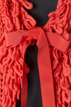 Orange knit long vets with franges and bow GALLIANO
