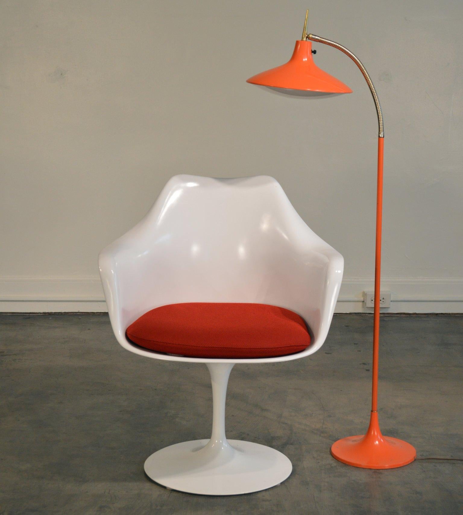 Mid-Century floor lamp designed by Richard Barr and Harold Weiss for the Laurel Lamp Company circa 1960's. Original Tangerine color, model B-683, UFO shaped floor lamp on articulating brass gooseneck with tulip-shaped orange enameled metal base.