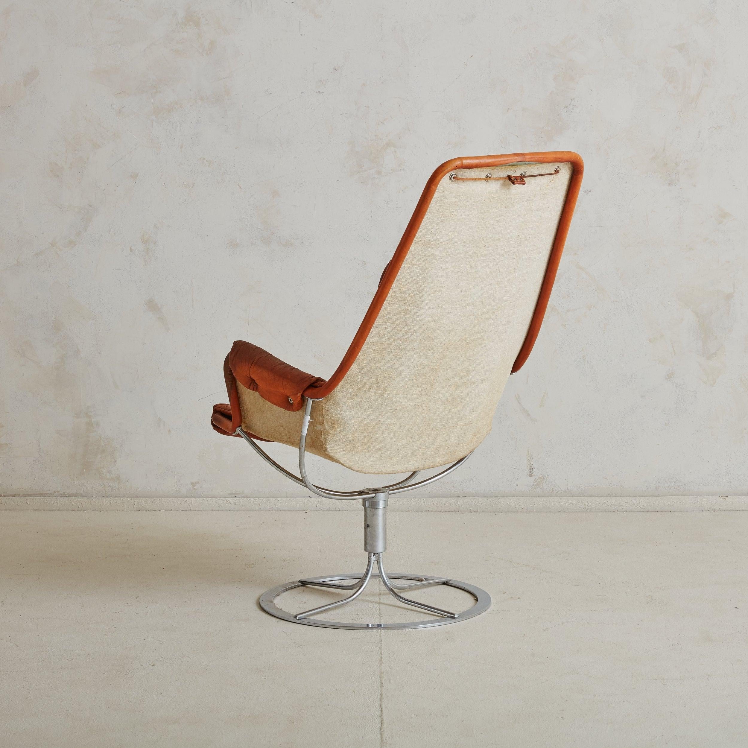 Space Age Orange Leather + Chrome 'Jetson' Swivel Lounge Chair by Bruno Mathsson for DUX For Sale