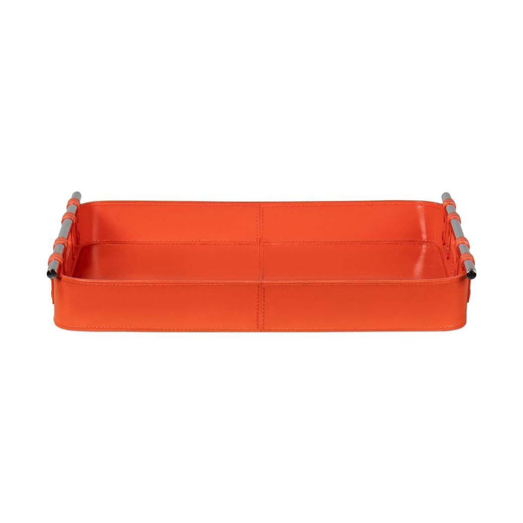 With a bold orange leather, this leather tray is fraught with detail: the topstitching of each leather panel, the narrow leather straps that hold the stainless steel handles in place. 

Dimensions: 19