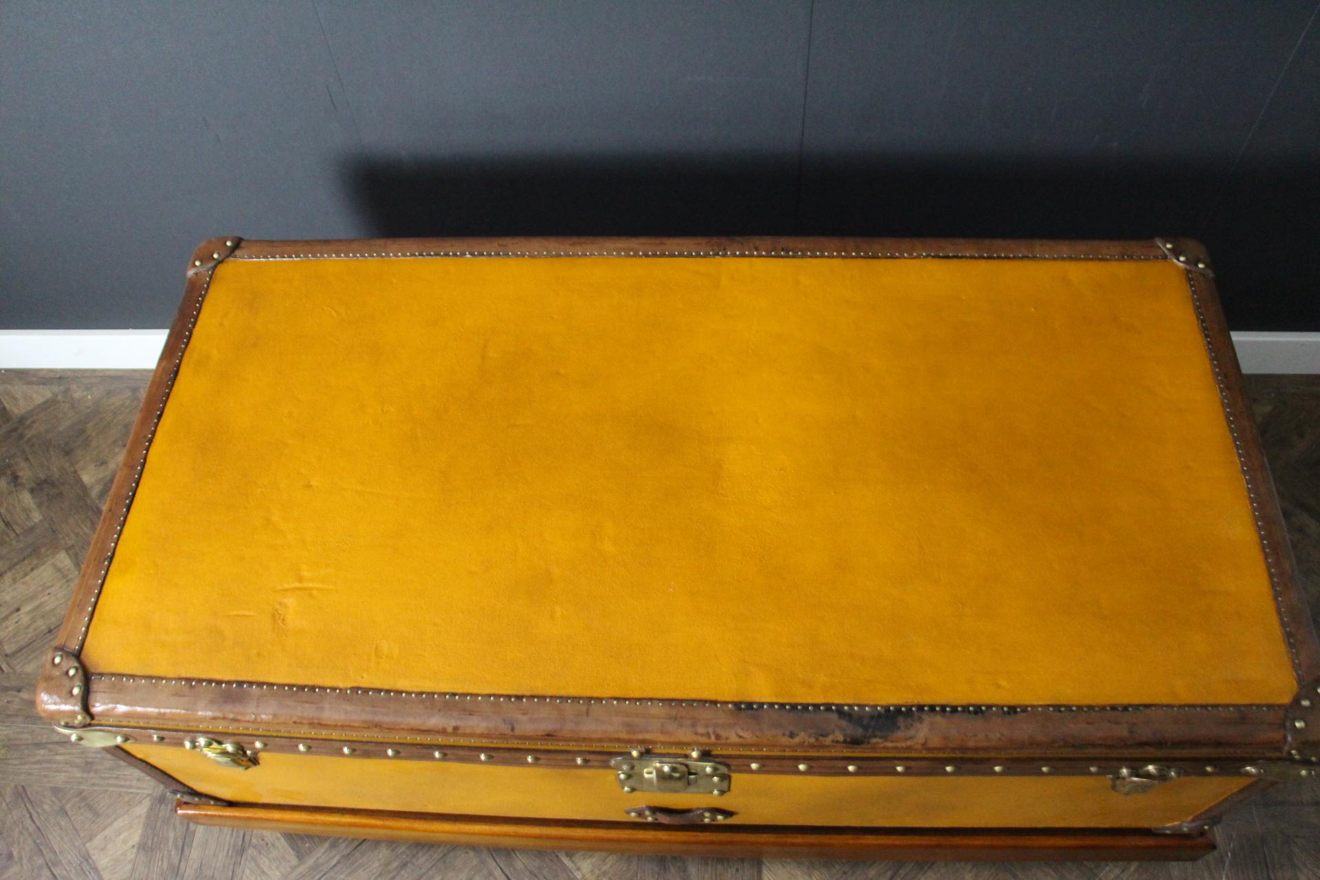 This very nice orange canvas Louis Vuitton steamer trunk, features Louis Vuitton stamped solid brass lock, clasps as well as all its studs. Beautiful and rich chocolate color all leather trim and handles. Unusual and elegant proportions.
It is
