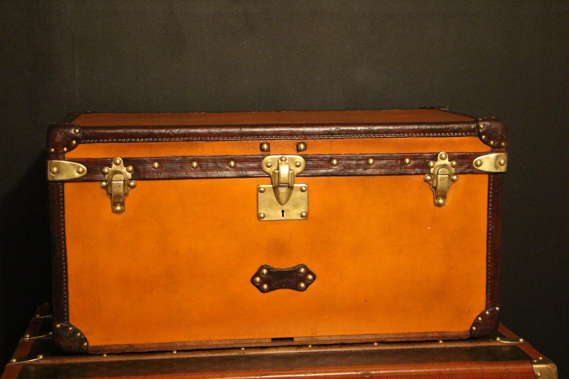 This magnificent Louis Vuitton shoe trunk features the very sought after orange canvas , Louis Vuitton stamped solid brass locks, studs and latches as well as beautiful large side handles in leather. It also has got all chocolate leather trim. It