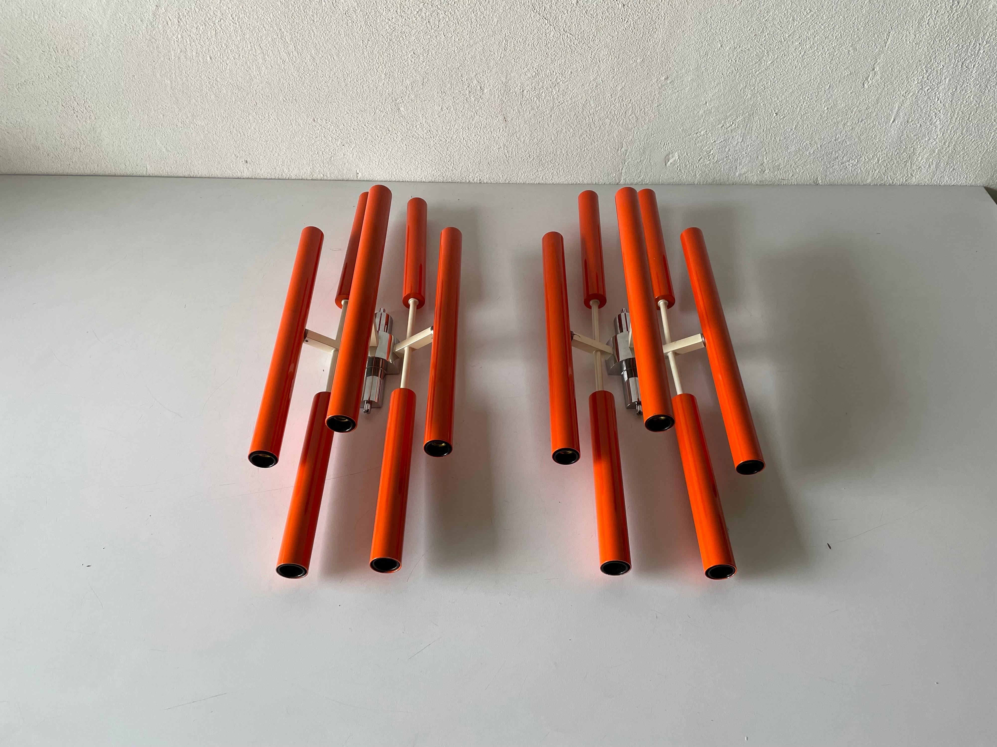 Orange metal 10 socket tubes exclusive large pair of sconces, 1970s, Italy

Very elegant and Minimalist sconces

Lamps are in very good condition.

These lamps works with 10xE14 standard light bulbs. 
Wired and suitable to use in all
