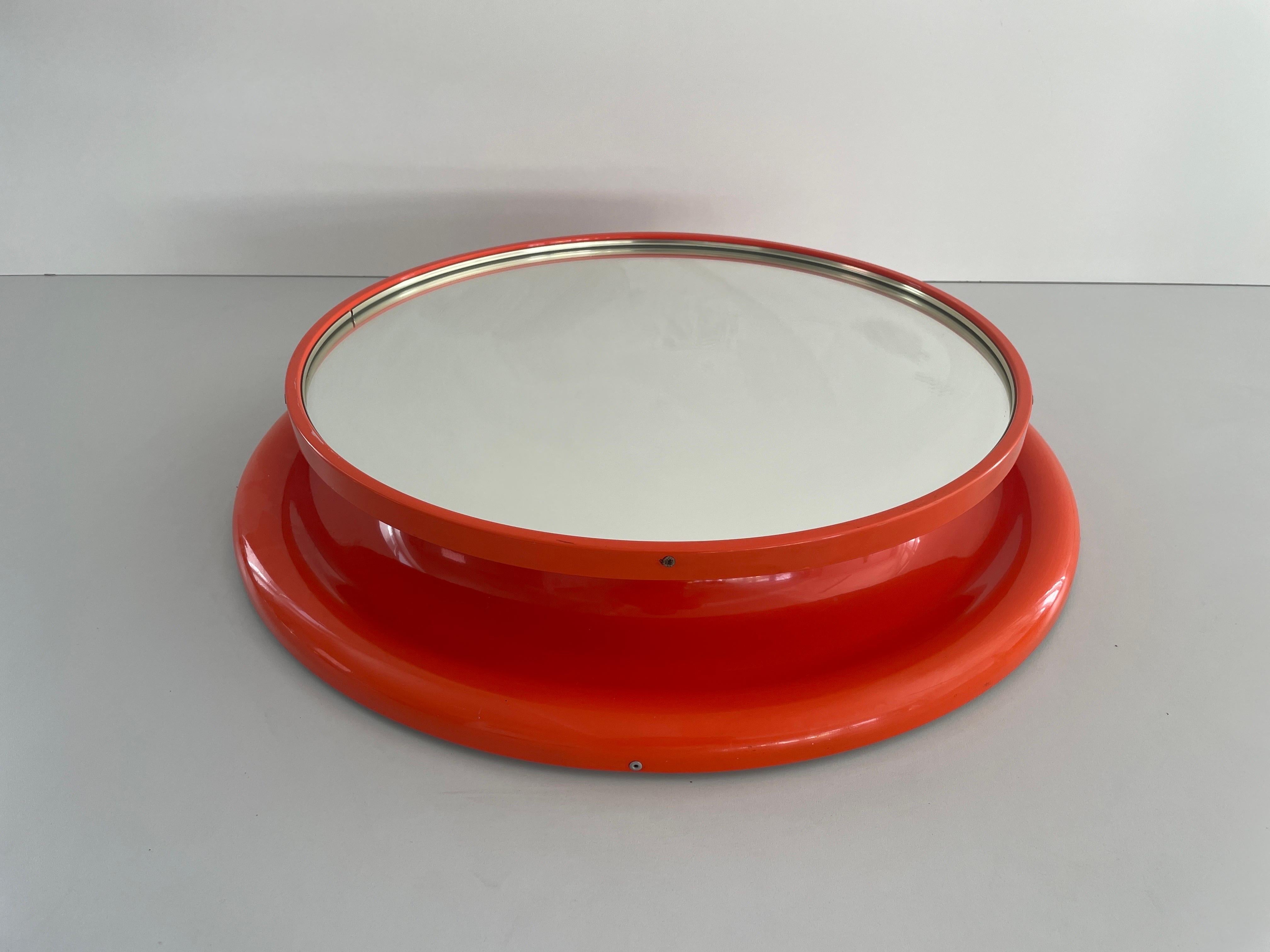 Orange Metal Pop Art Round Wall Mirror, 1970s, Italy

It is very ideal and suitable for all living areas.

No damage, no crack.
Wear consistent with age and use.

Measurements: 
Diameter: 58 cm
Mirror diameter: 46 cm
Depth: 10 cm