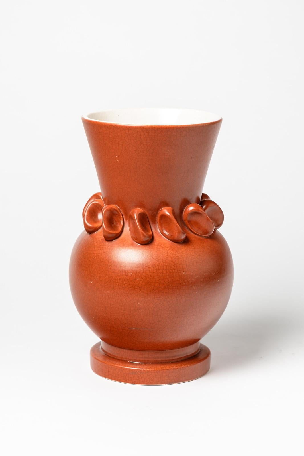 Pol Chambost

Made in France, original orange midcentury ceramic vase by the french artist.

Realised circa 1950

Original perfect condition

Interior with white ceramic glaze color

Signed under the base: MADE IN FRANCE

Measures: