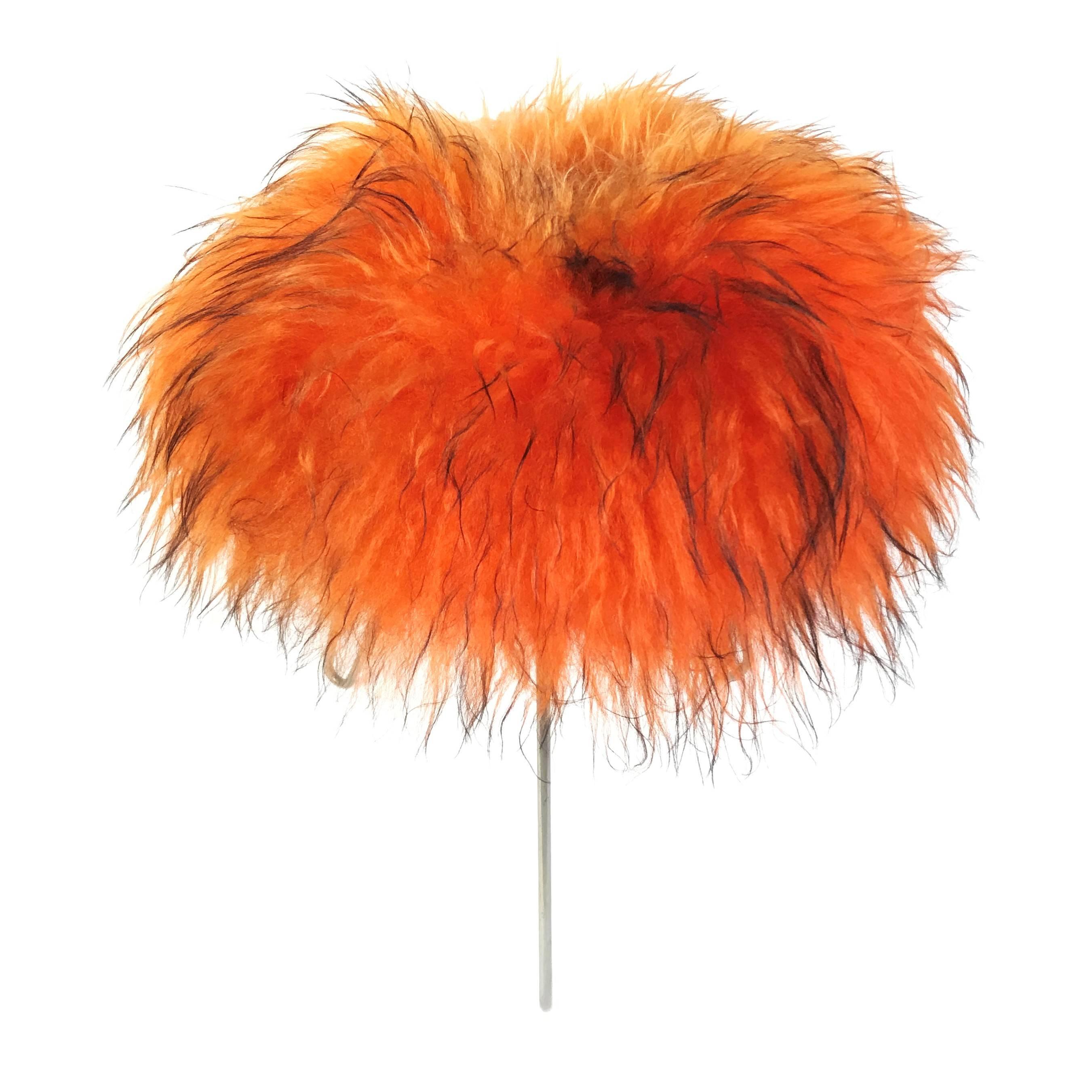 Very decorative handmade French 1950s lambswool fur stool in the style of Jean Royère. The long orange lambswool fur was dyed black at the ends to intensify the visual depth, and the three chromed hairpin legs serve as a reduced, minimalist