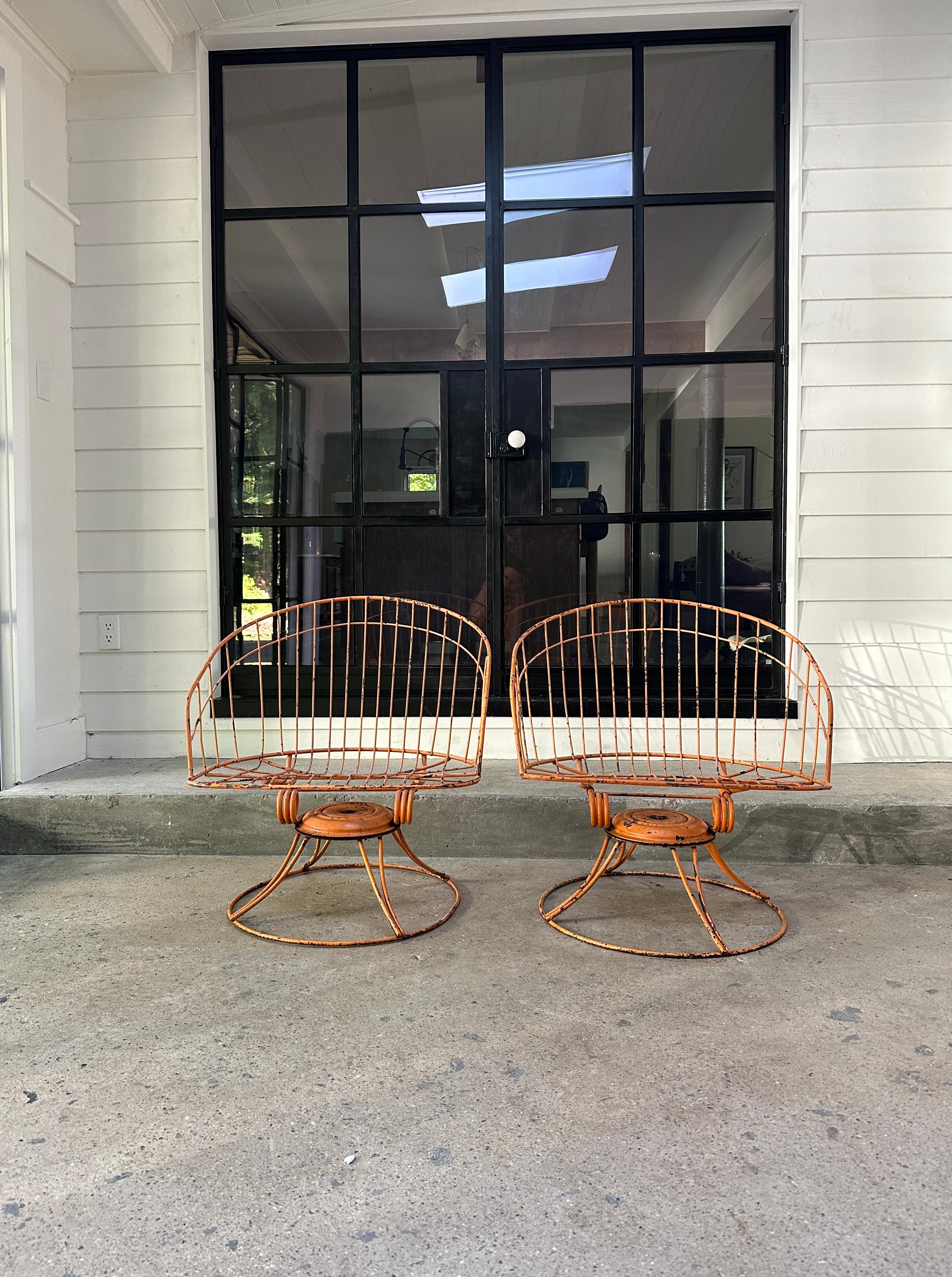 Vintage pair of orange chairs with a comfortable deep barrel back. Both swivel and rock like any other Homecrest’s 