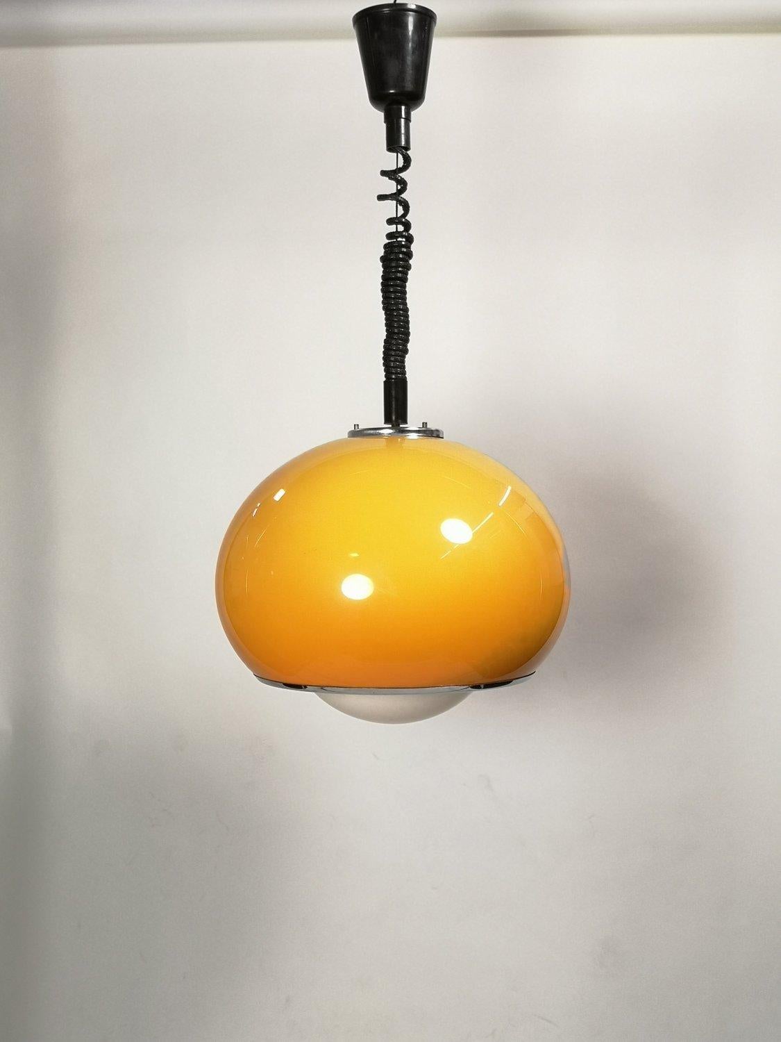 Mid-Century Modern Meblo drop light by Harvey Guzzini. The orange variation (this color) is said to be the best looking verion of this model. Overall good condition, although there is some minor wear consistent with age and use.