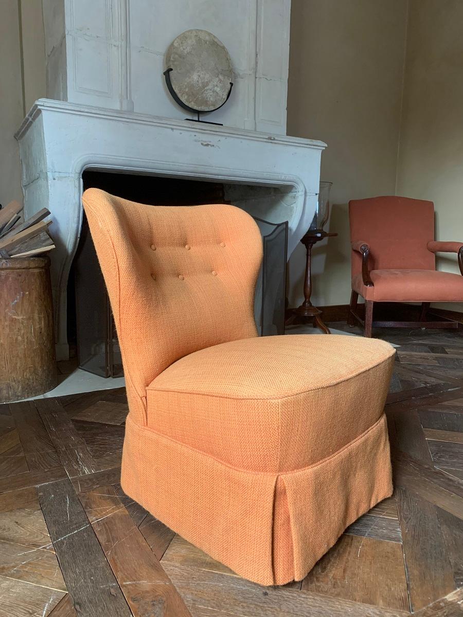 A midcentury cocktail chair by Theo Ruth for Artifort, 1950s. Upholstered with the original rust orange fabric. Lovely proportions and lines in a high end production.