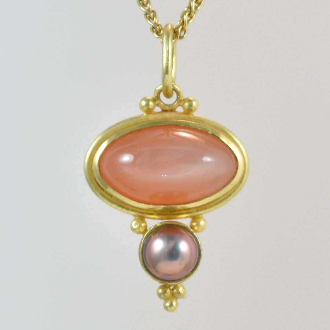 18k Royal Yellow Gold Pendant with Orange Moonstone and Black Pearl - Unearth the radiance of our meticulously handcrafted pendant, designed by the renowned Lynn Kathyrn Miller of Lynn K Designs. This exceptional jewelry piece, featuring a