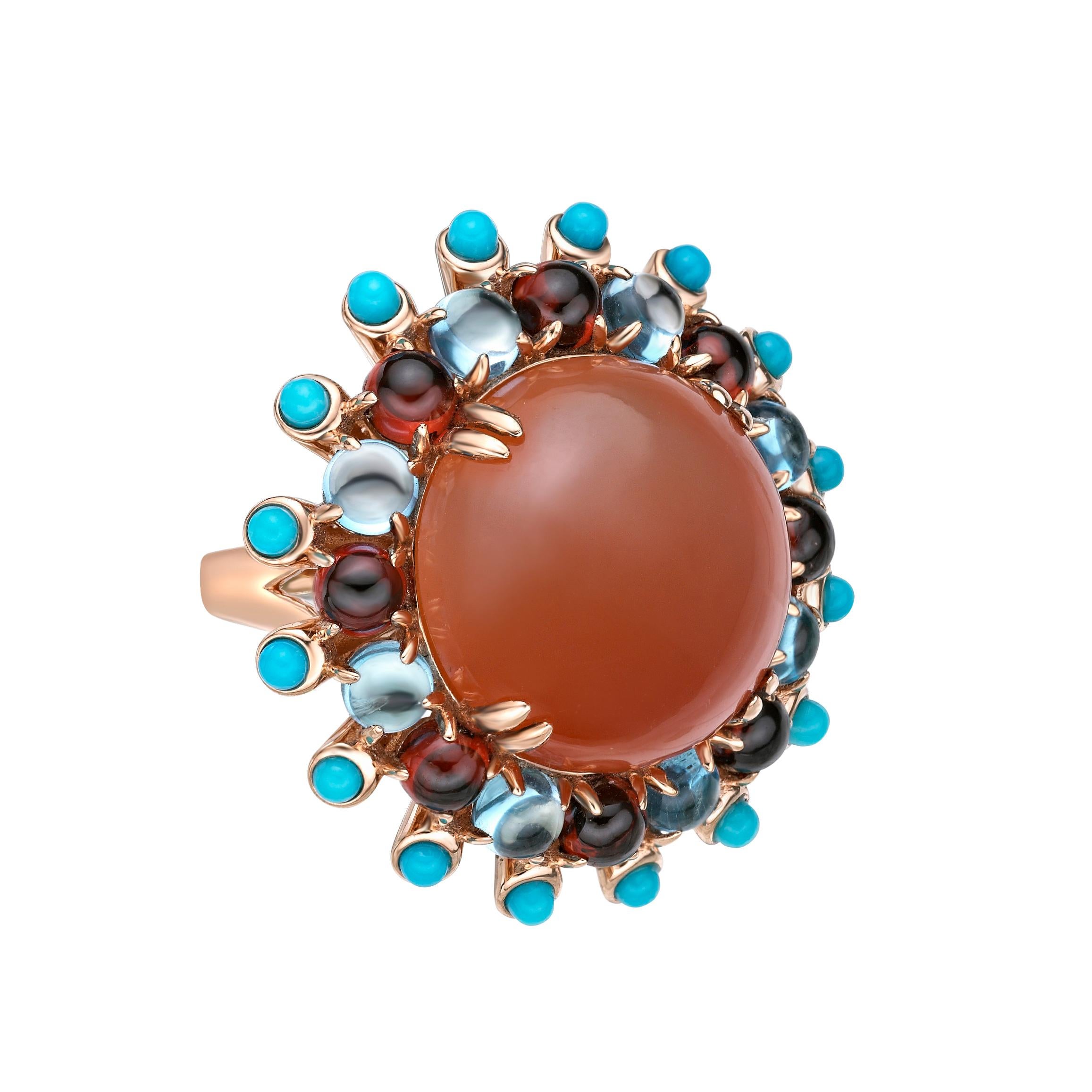 Sunita Nahata presents a collection of bold and colorful cocktail rings. This ring features a bold yet subtle orange moonstone round cabochon. The center stone is surrounded by a trio of garnet, topaz and turquoise also as round cabochons. 

Orange