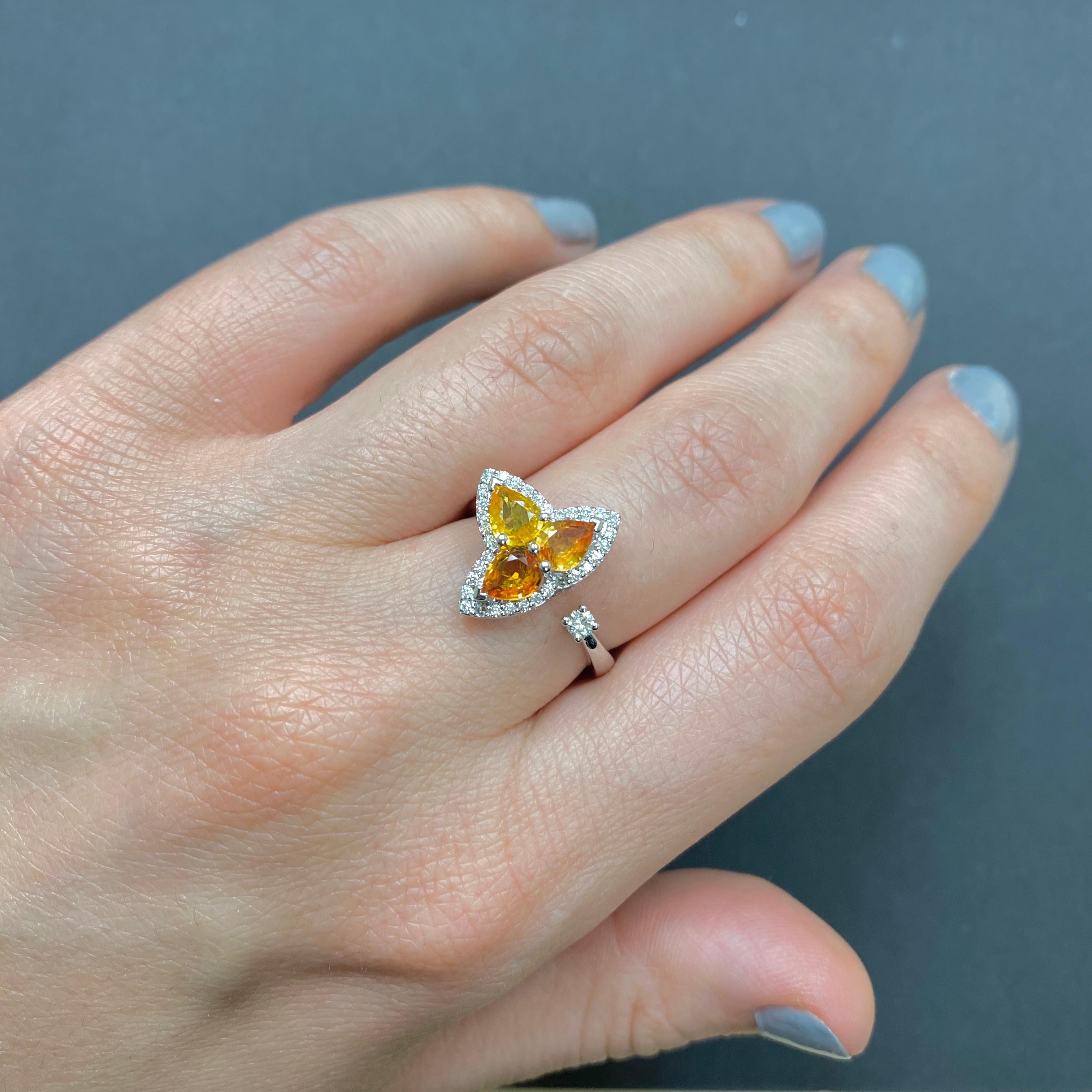 Material: 14K White Gold
Stone Details: 3 Pear Shaped Multicolor Sapphires at 1.13 Carats - Measuring 4 x 5 mm
Diamond Details: 35 Brilliant Round White Diamonds at 0.19 Carats- Clarity: SI / Color H-I
Alberto offers complimentary sizing on all