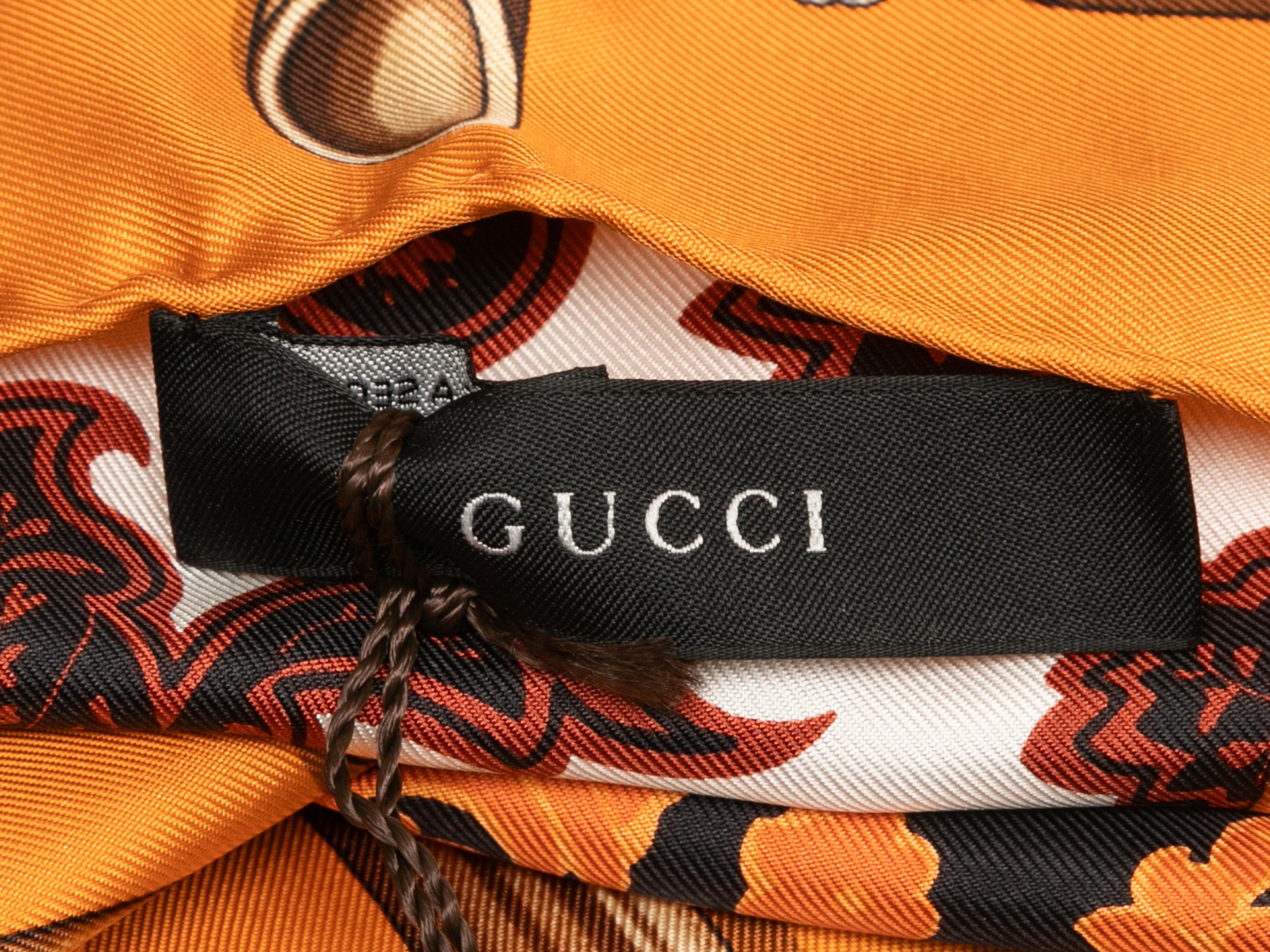 Orange and multicolor silk abstract print square scarf by Gucci. 34.5