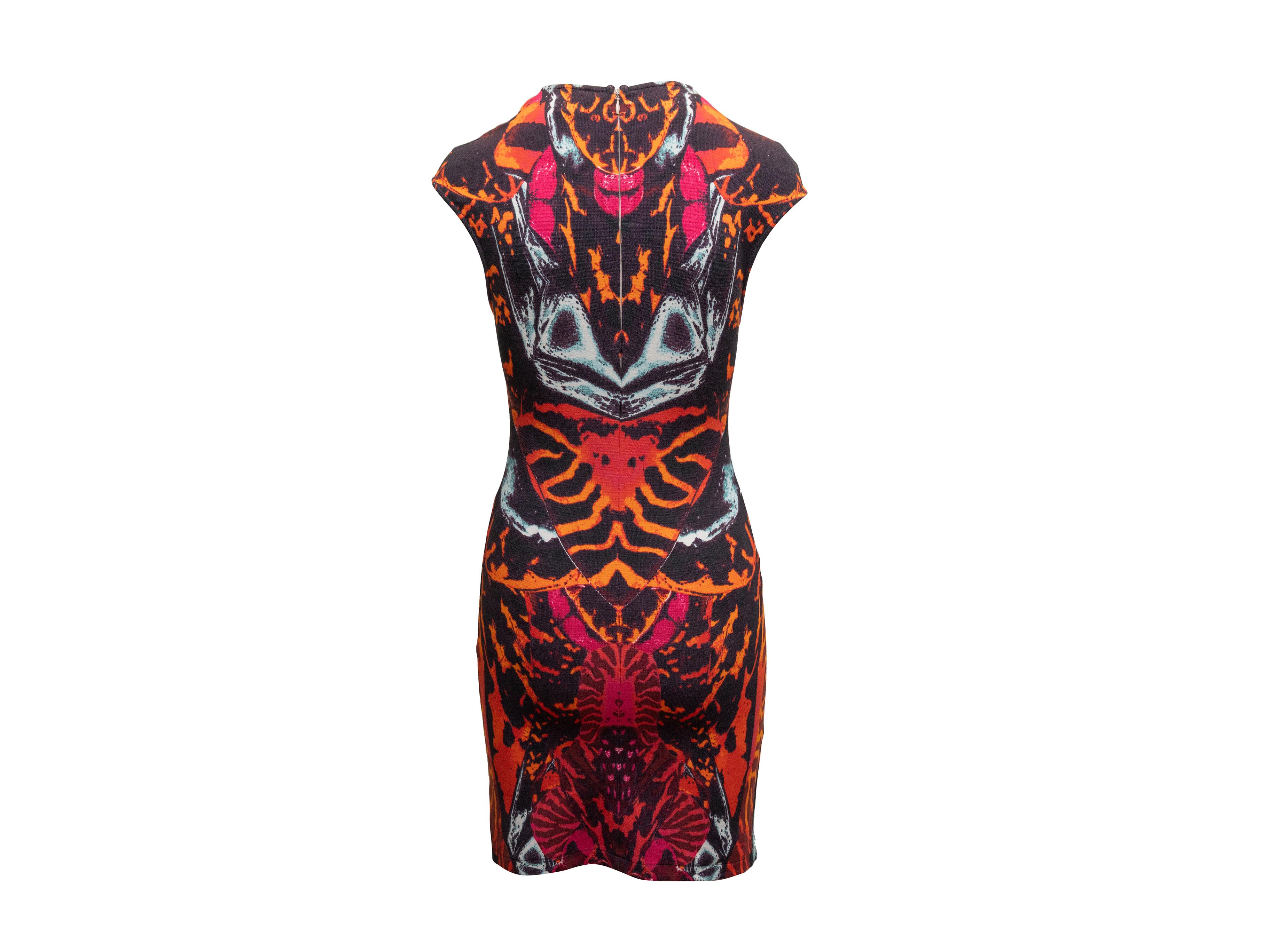 Orange and multicolor kaleidoscope butterfly print bodycon dress by McQ Alexander McQueen. Crew neck. Cap sleeves. Zip closure at back. 28