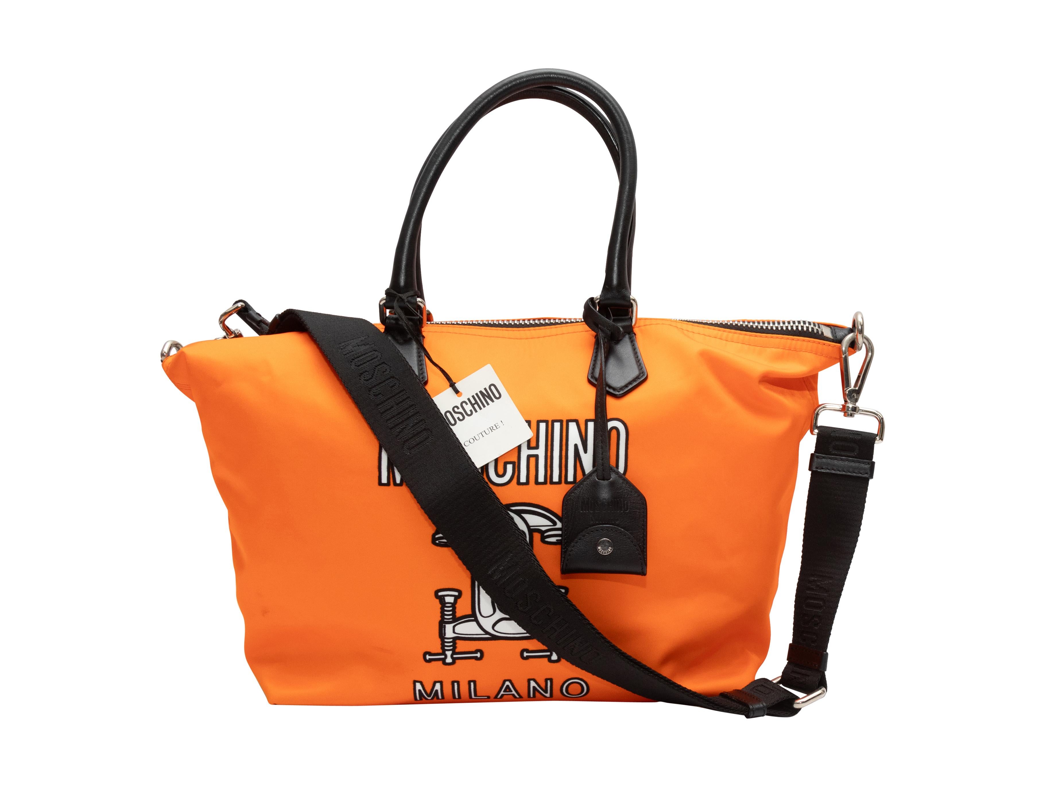 Orange & Multicolor Moschino Couture Nylon Shopper Tote. This shopper tote features a nylon body, leather trim, silver tone hardware, front logo print, dual rolled top handles, a single flat shoulder strap, and a top zip closure. 20