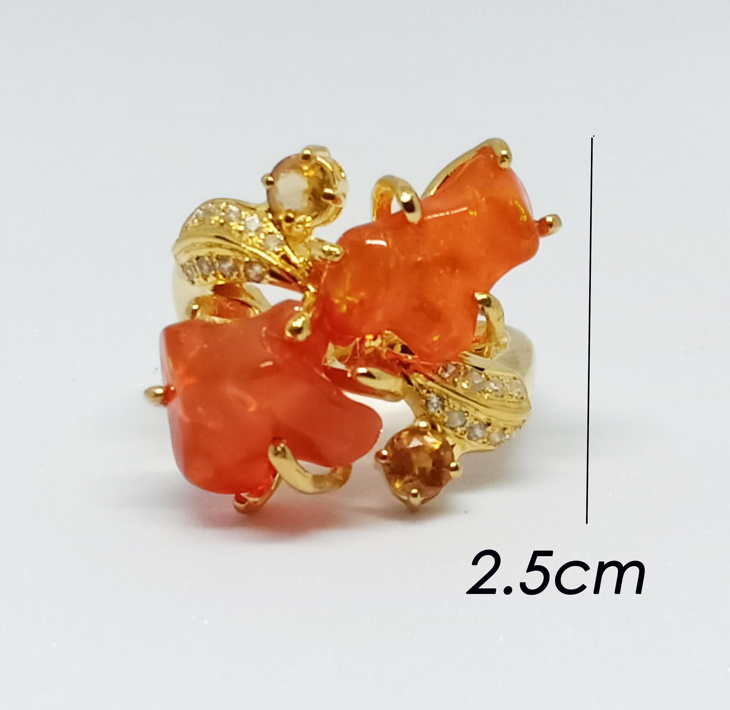 Orange Opal tumble (free form shape) 6.25 cts 2 pcs.
Honey yellow zircon 3.0 mm 2 pcs.
White zircon 
18k gold plated over sterling silver 
size 7 us.

Storefront (search) ornamento jewellery