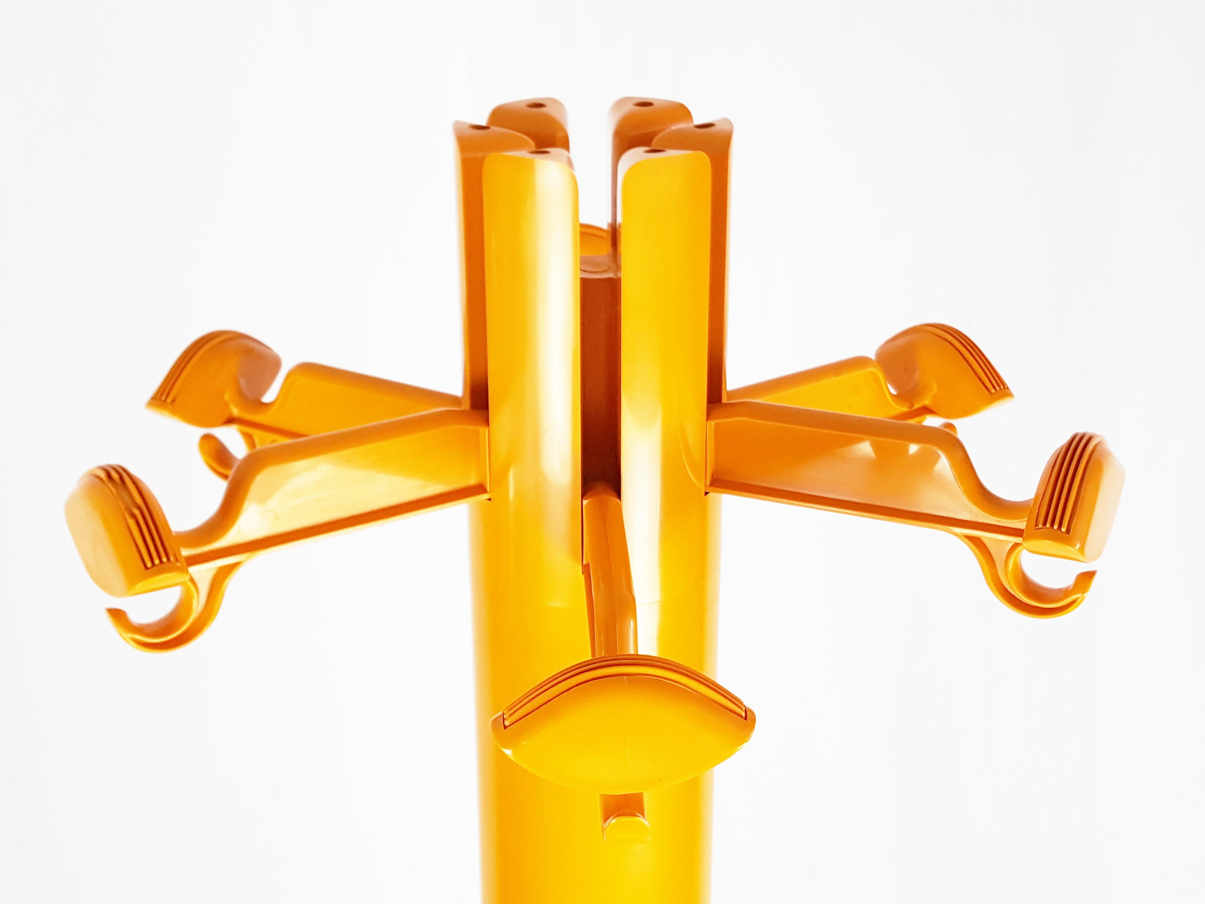 Italian Orange plastic free standing coat rack Planta by G. Piretti for Anonima Castelli For Sale