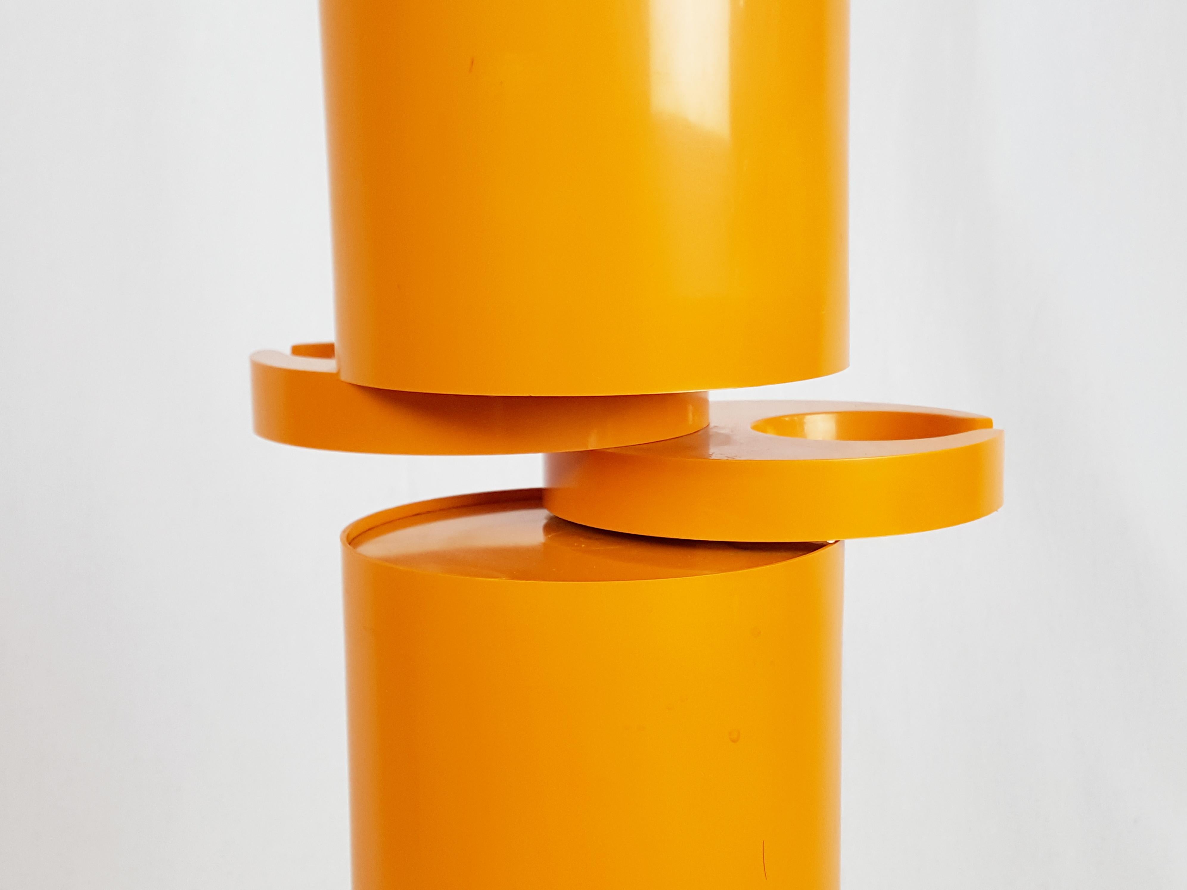 Late 20th Century Orange plastic free standing coat rack Planta by G. Piretti for Anonima Castelli For Sale