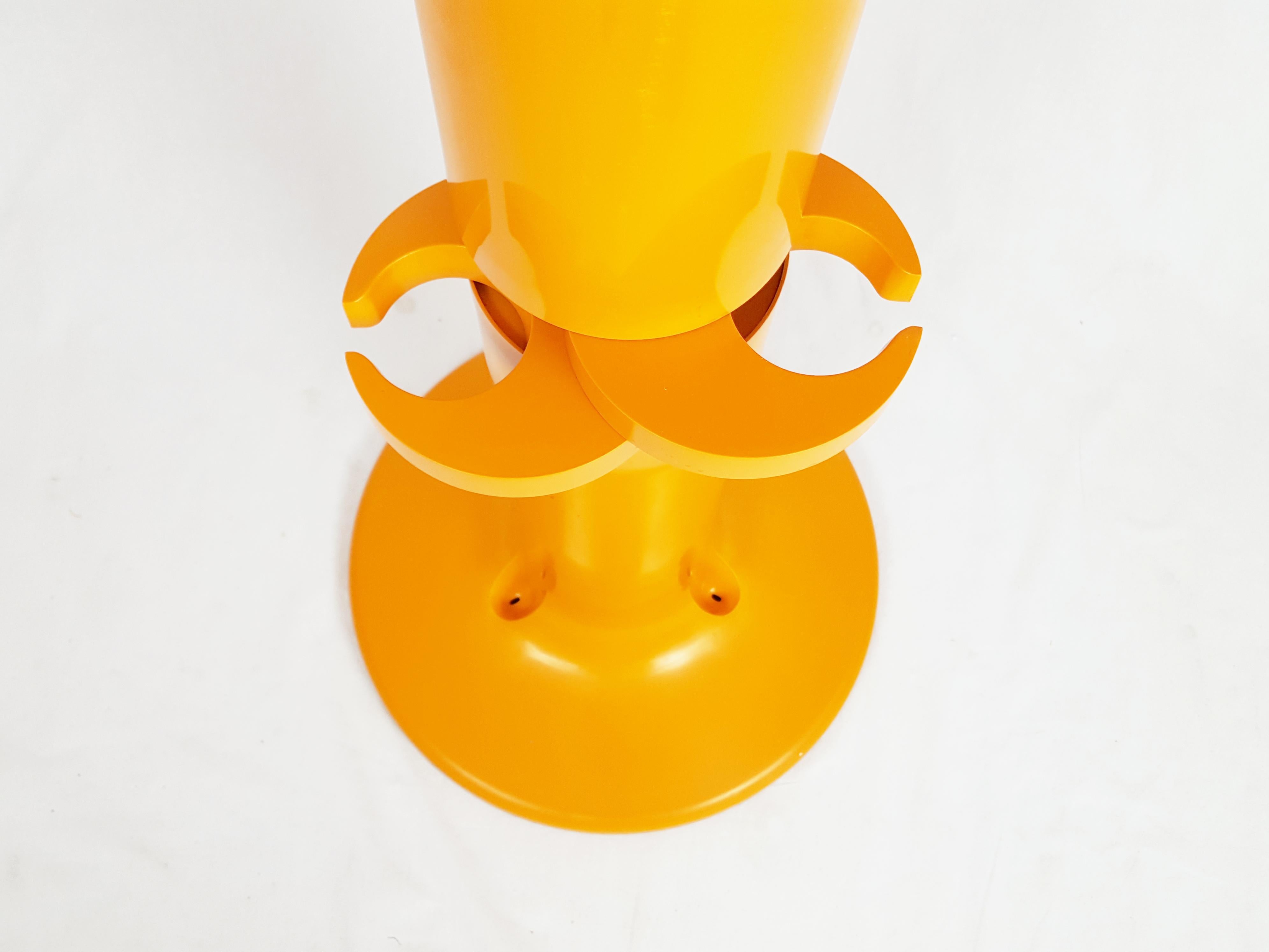 Orange plastic free standing coat rack Planta by G. Piretti for Anonima Castelli For Sale 1