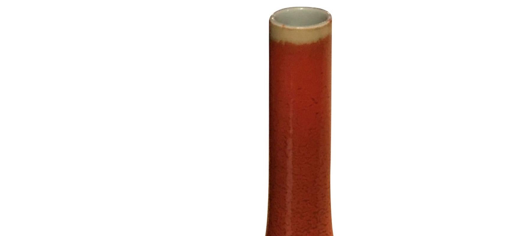 Chinese orange glazed thin necked porcelain vase.
Sits nicely with S5127.