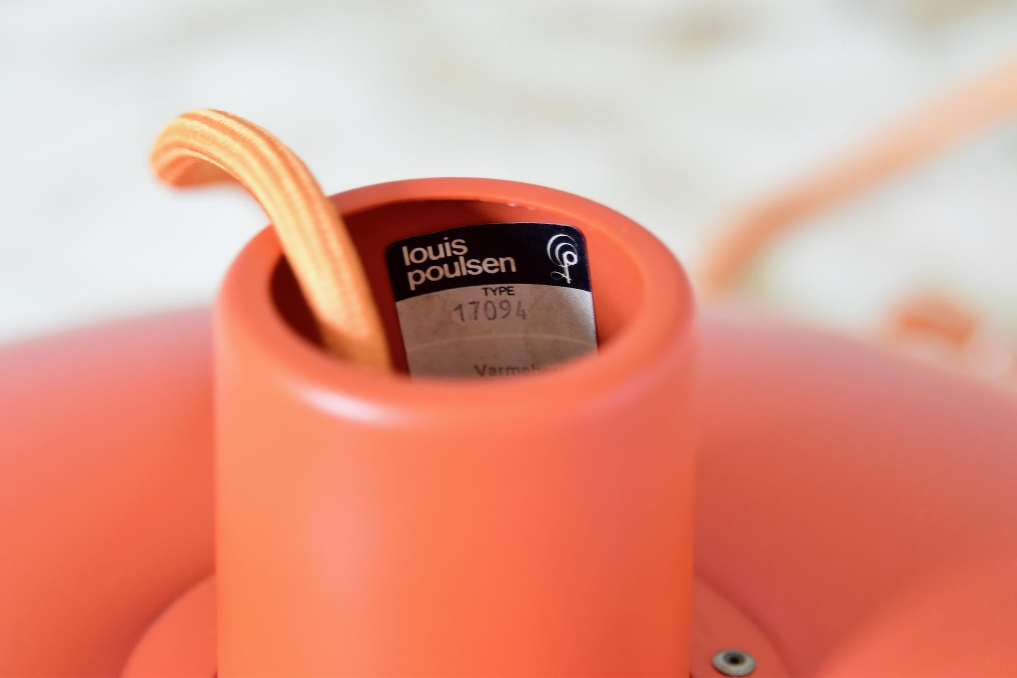 Very nice orange PH 4/3 from Poul Henningsen produced by Louis Poulsen, Made in Denmark. The lamp in this color is out of production and is in very very good condition. No parts missing, no scratches, no dents and nothing bent. With new orange