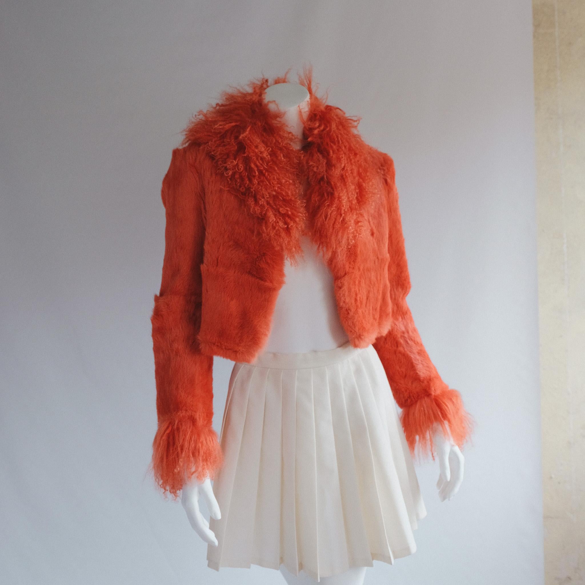 Orange rabit fur coat with Mongolian long goat fur penny lane detail.
Fully lined.
So soft and so warm
TRULY ICONIC

Tag size nil
Our fit estimate: depending on desired fit 6-8
Pictured on size 6 5’5
Excellent vintage condition, light wear to be