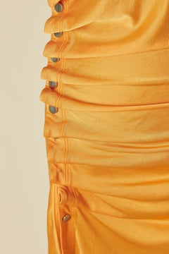 Orange rayon jersey dress draped on the side with snap RABANNE