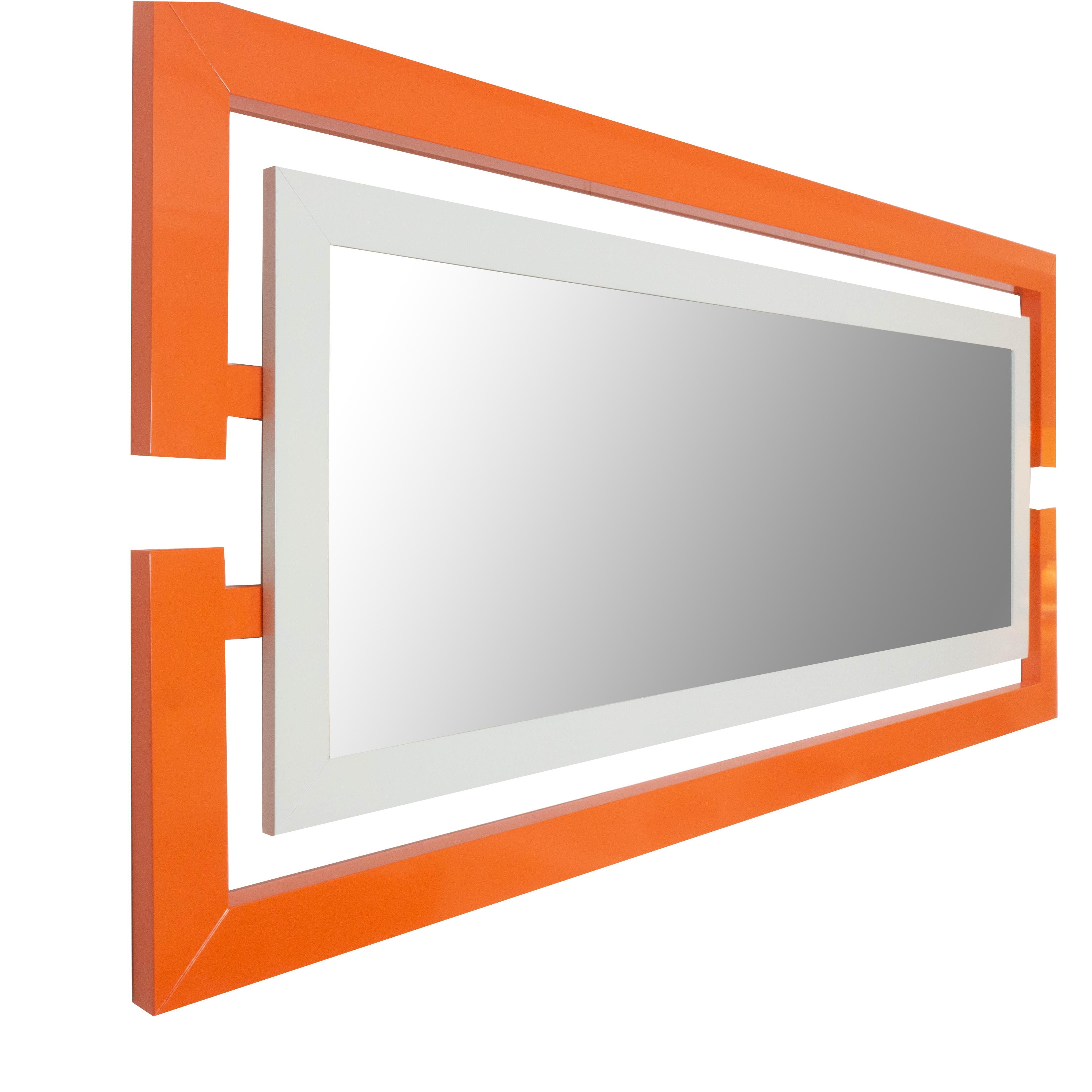 Inspired by the Space Age, this modern rectangle wall mirror lacquered in a matte orange can be bought as shown or customized to your liking. Handcrafted in our studio in Norwalk, Connecticut. 

Measurements: 34
