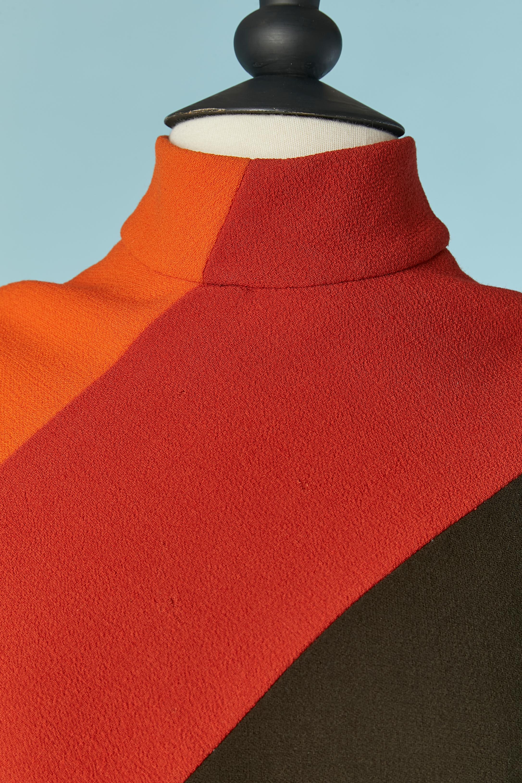 Orange, red and brown wool patchwork dress. No fabric composition tag but the lining is probably in silk ( and not inside the sleeve, only the body)
Zip closure and hook&eye on the middle back. 
SIZE 38 (Fr) M 