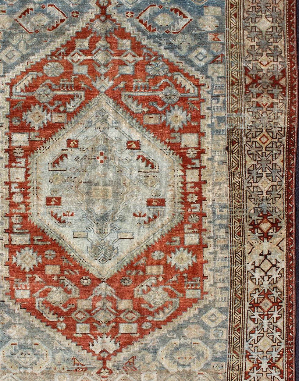 Antique Persian rug in shades of orange-red, light blue gray, and taupe, rug SUS-1908-2, country of origin / type: Iran / Malayer, circa 1910.

This traditional Persian Malayer carpet from the early 20th century is characterized by its orange-red