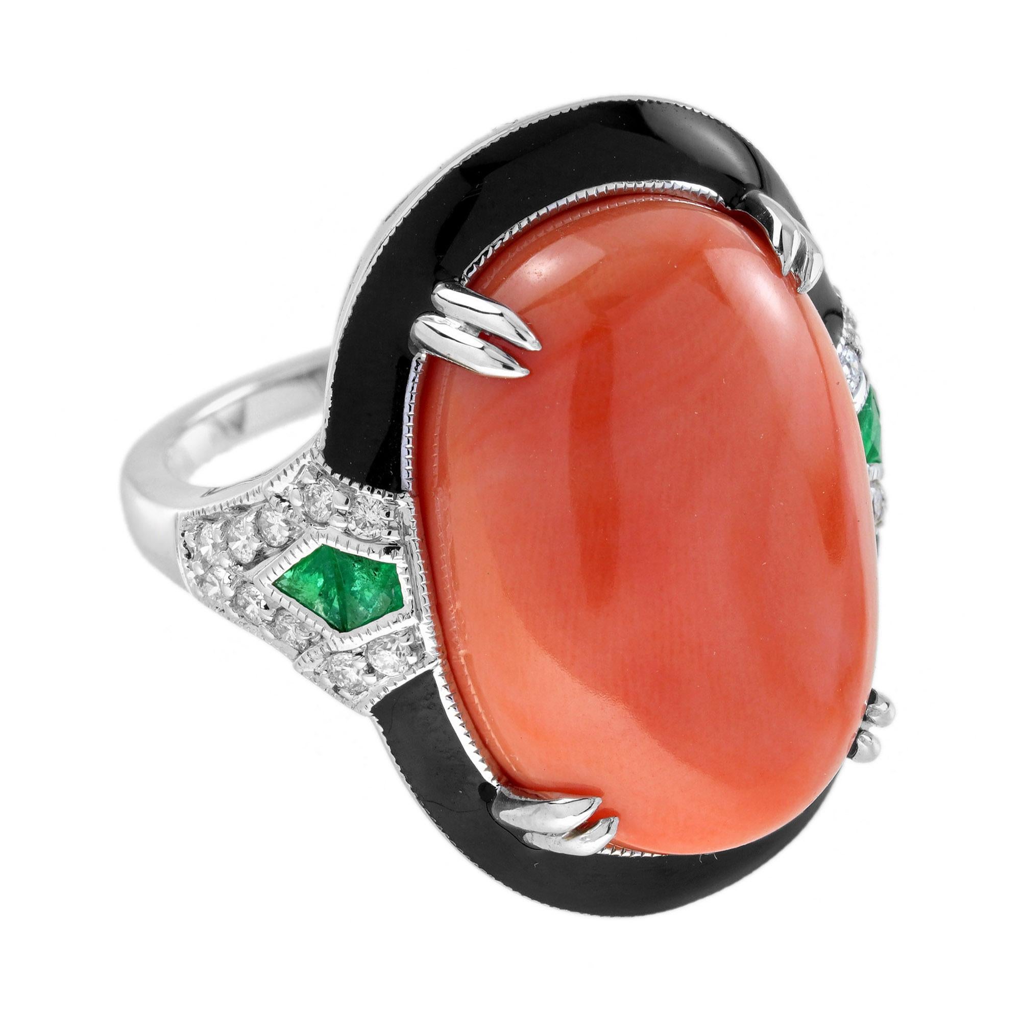 Showcase your unique style with this stunning cocktail ring. Centered with an amazing 18.68 carat (approx.) Momo coral in claw setting, the ring is decorated with French cut emeralds and diamonds on both sides. Featuring a gorgeous combination of