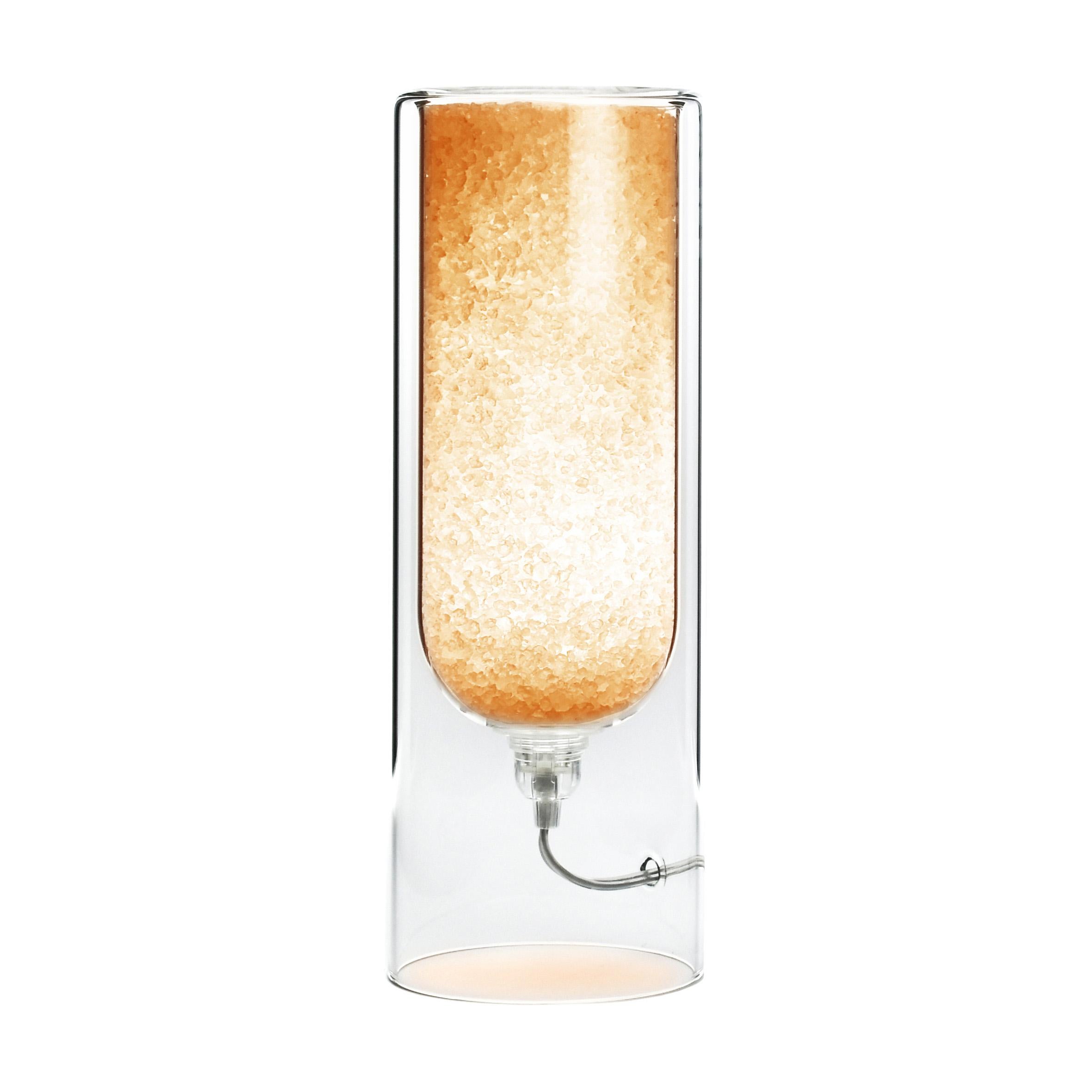 Orange Rocklumìna XXS table lamp by Coki Barbieri.
Dimensions: W 12 x D 12 x H 33.5 cm.
Materials: Italian rock salt crystals colored with natural pigments, mineral pigments from Italian soil and borosilicate glass.

All our lamps can be wired