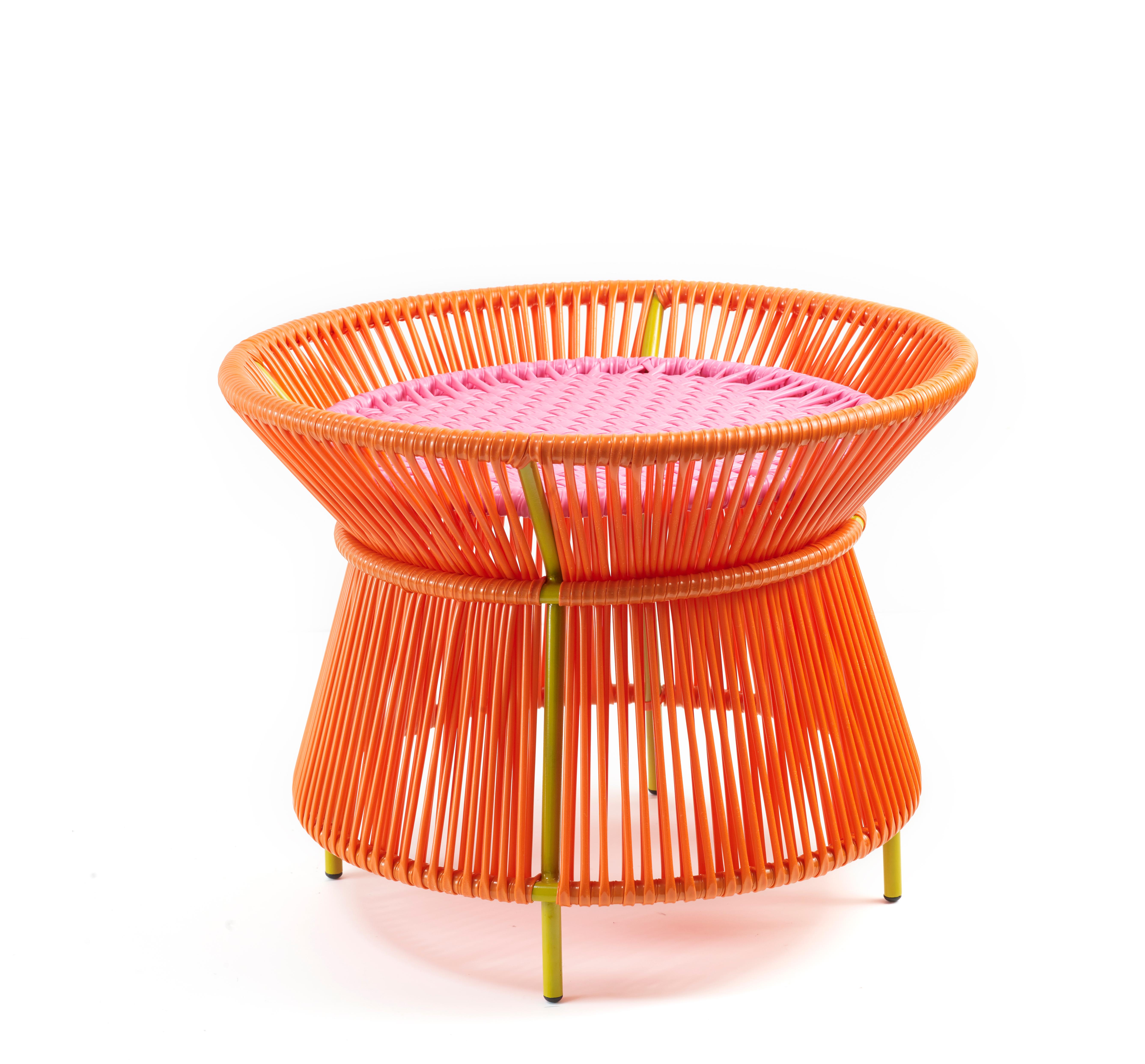 Orange Rose Caribe basket table by Sebastian Herkner
Materials: Galvanized and powder-coated tubular steel. PVC strings are made from recycled plastic.
Technique: Made from recycled plastic and weaved by local craftspeople in Colombia.