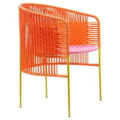 Chaise de salle à manger Caribe orange-rose de Sebastian Herkner