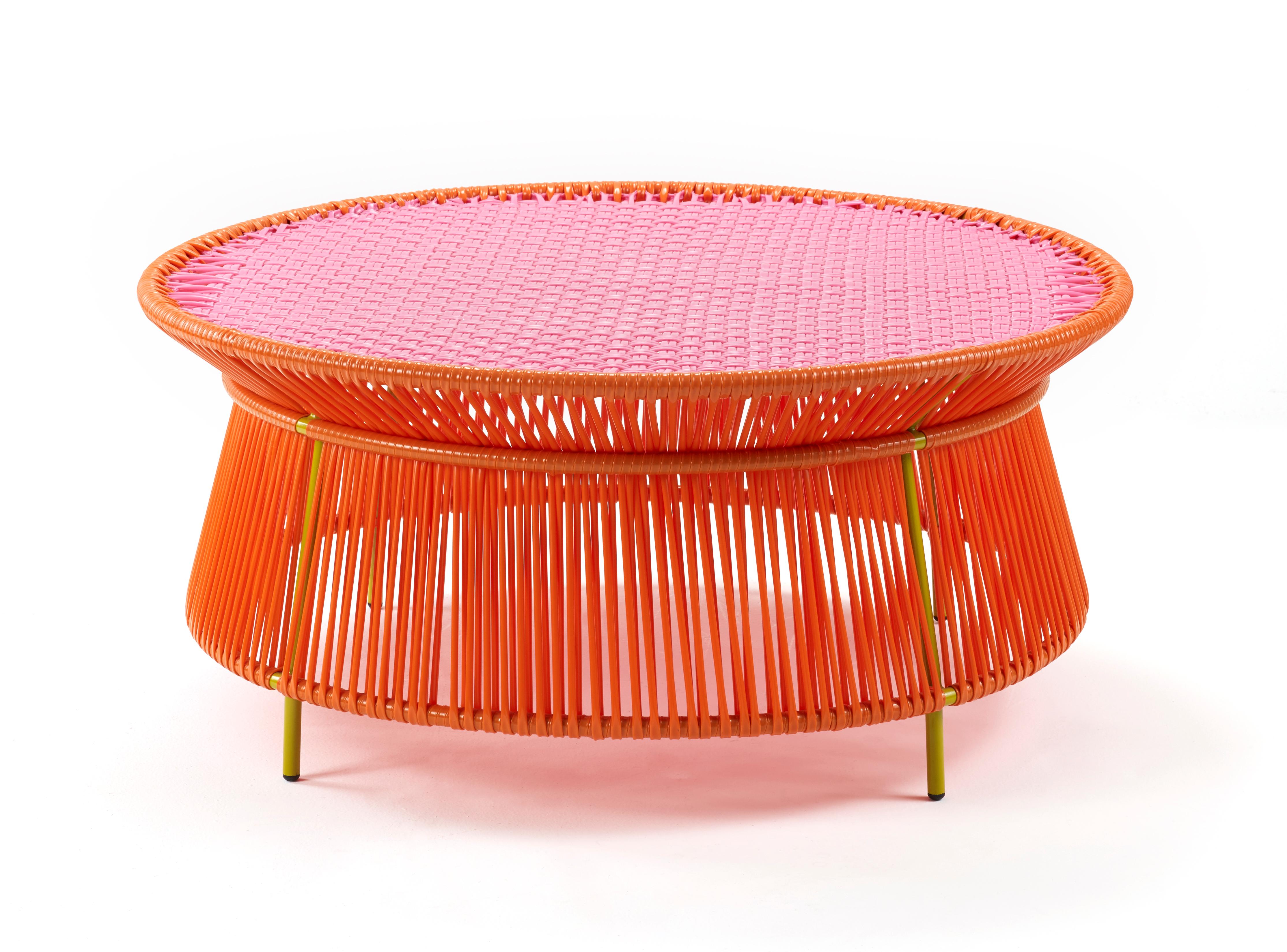 Orange rose Caribe low table by Sebastian Herkner
Materials: Galvanized and powder-coated tubular steel. PVC strings are made from recycled plastic.
Technique: Made from recycled plastic and weaved by local craftspeople in Colombia. 
Dimensions: