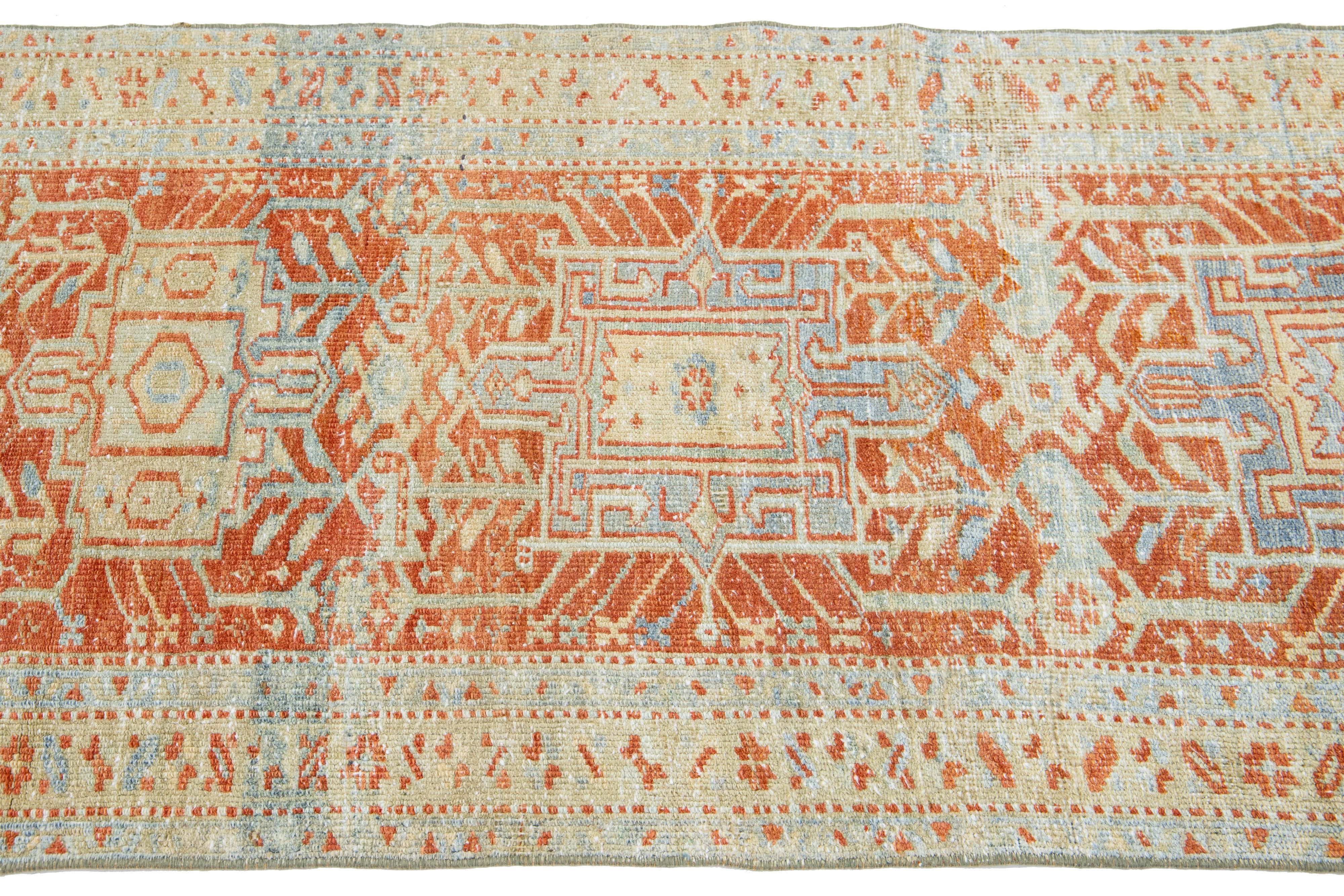 Hand-Knotted Orange Rust Antique Heriz Handmade Wool Runner Featuring an Allover Pattern For Sale