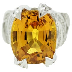 Bague en or avec saphir orange et diamants