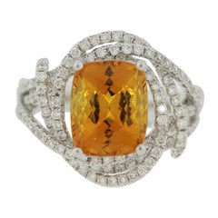 Bague en or ornée de saphir orange et de diamants, certifiée GIA