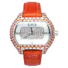 Reloj de lujo de cuarzo suizo de piel exótica con esfera pavé de zafiro naranja y diamantes