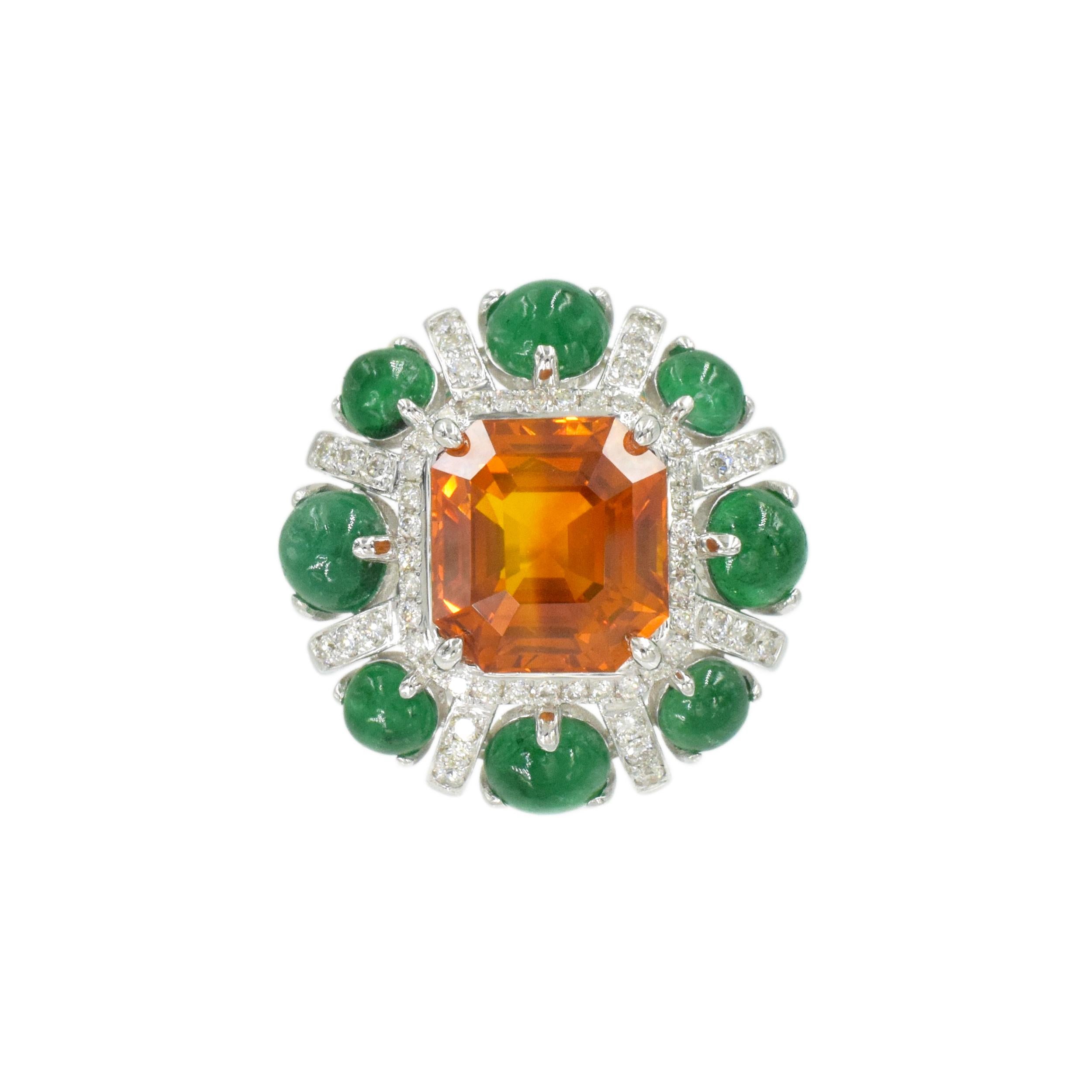 Orange Sapphire, Emerald, and Diamond Ring. This ring has a rectangular cut orange sapphire of 6.56 carats (Heat Treated, AGL# 1112782), round cabochon emerald   and diamonds of 0.40 total weight . all set in 18k white gold. Au750,  Ring size: 6.25;
