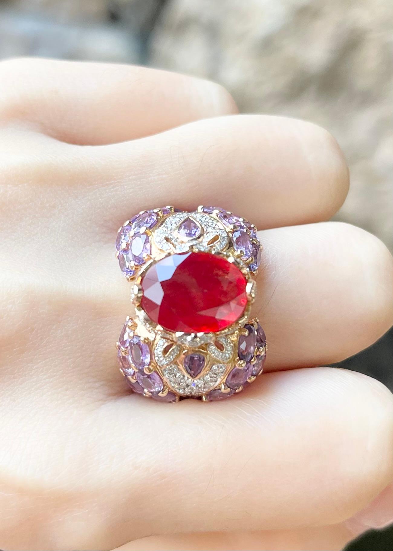 Orange Sapphire 4.79 carats, Purple Sapphire 8.10 carats and Diamond 0.78 carat Ring set in 18K Rose Gold Settings

Width:  2.5 cm 
Length: 1.9 cm
Ring Size: 56
Total Weight: 18.62 grams

Orange Sapphire
Width:  1.0 cm 
Length: 1.3 cm

