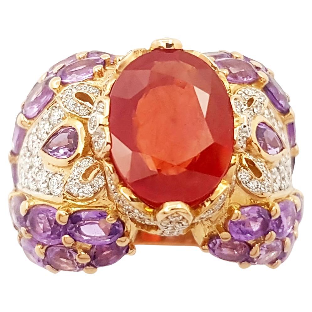 Bague en or rose 18 carats sertie de saphir orange, saphir violet et diamants