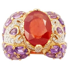 Bague en or rose 18 carats sertie de saphir orange, saphir violet et diamants