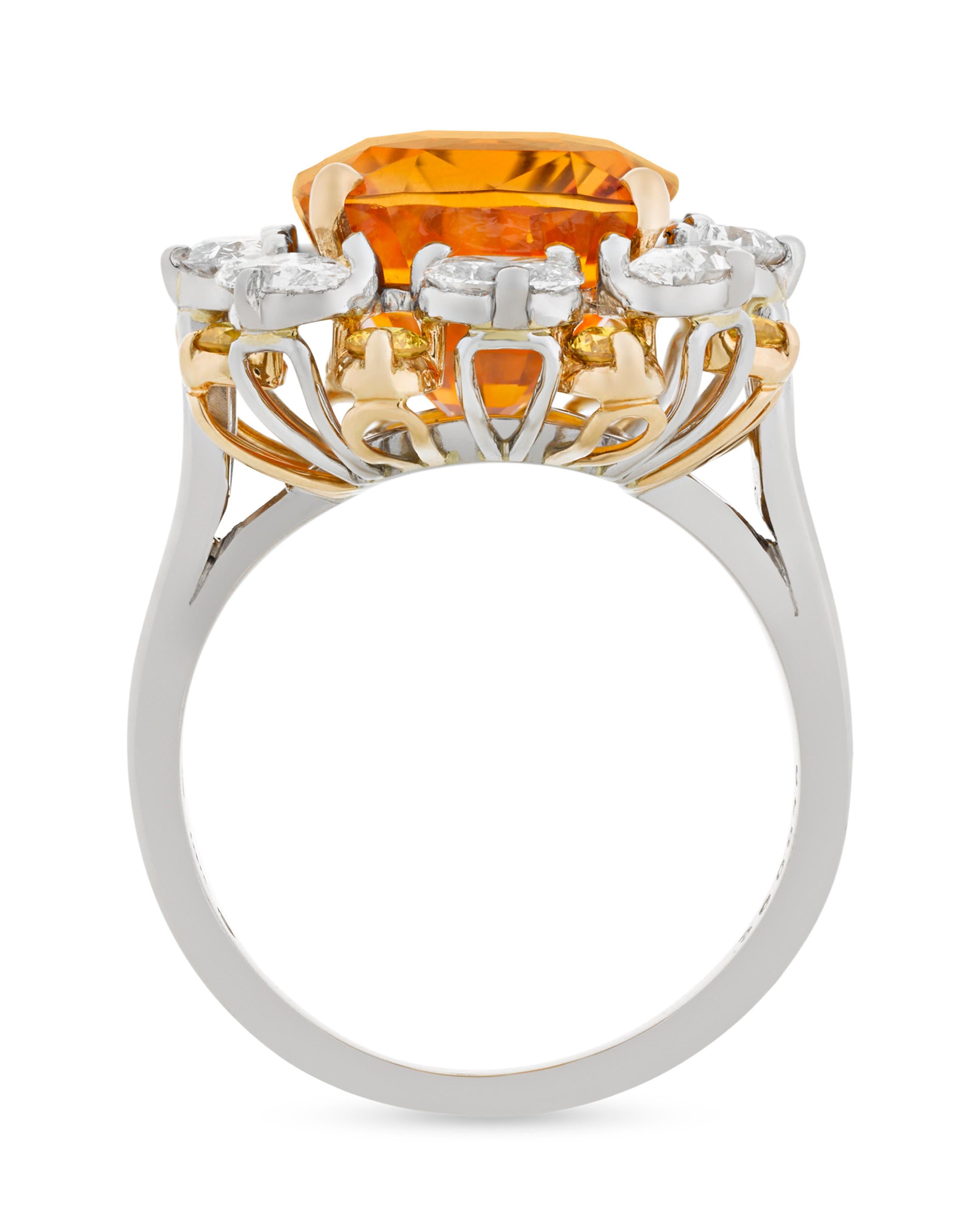 A dazzling 4.90-carat orange sapphire glows vibrantly in this eye-catching ring by the renowned Oscar Heyman. While sapphires are most commonly found in shades of blue or yellow, this jewel's rich orange is reminiscent of a mandarin garnet or fire
